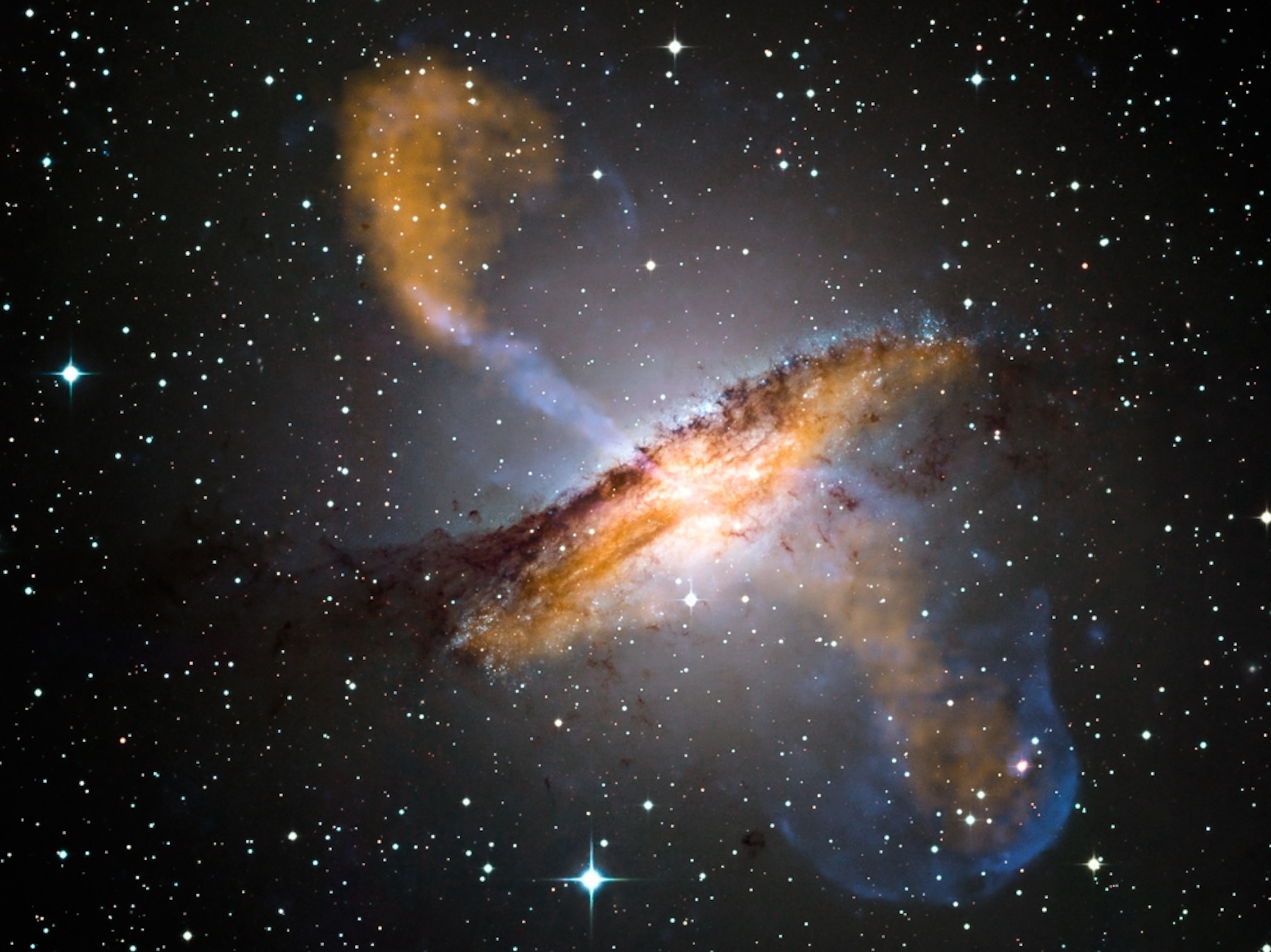 Jets of gas stream out from a black hole in galaxy Centaurus A.
