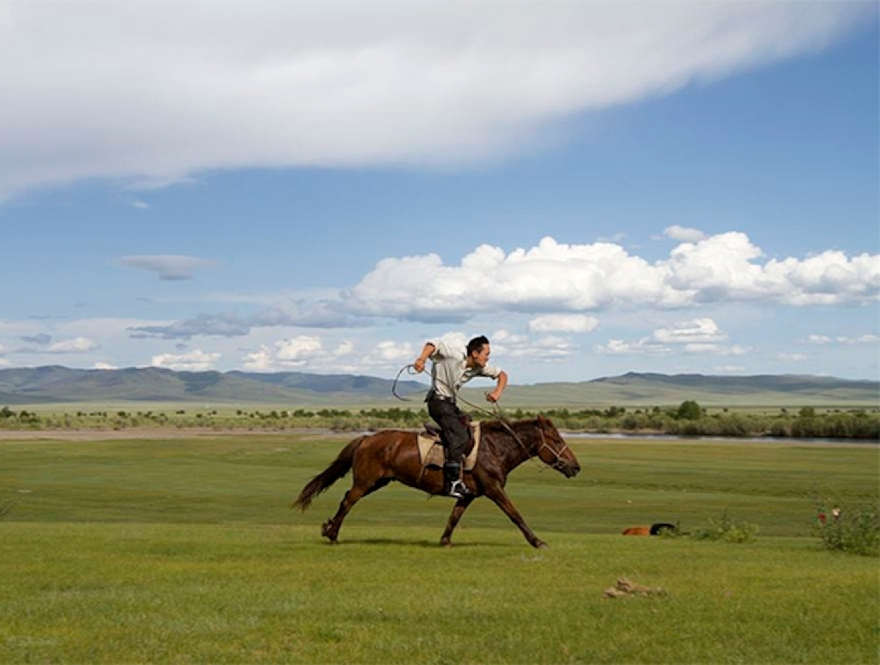 Lin on horseback in Mongolia (Photograph by Benjamin Horton)
