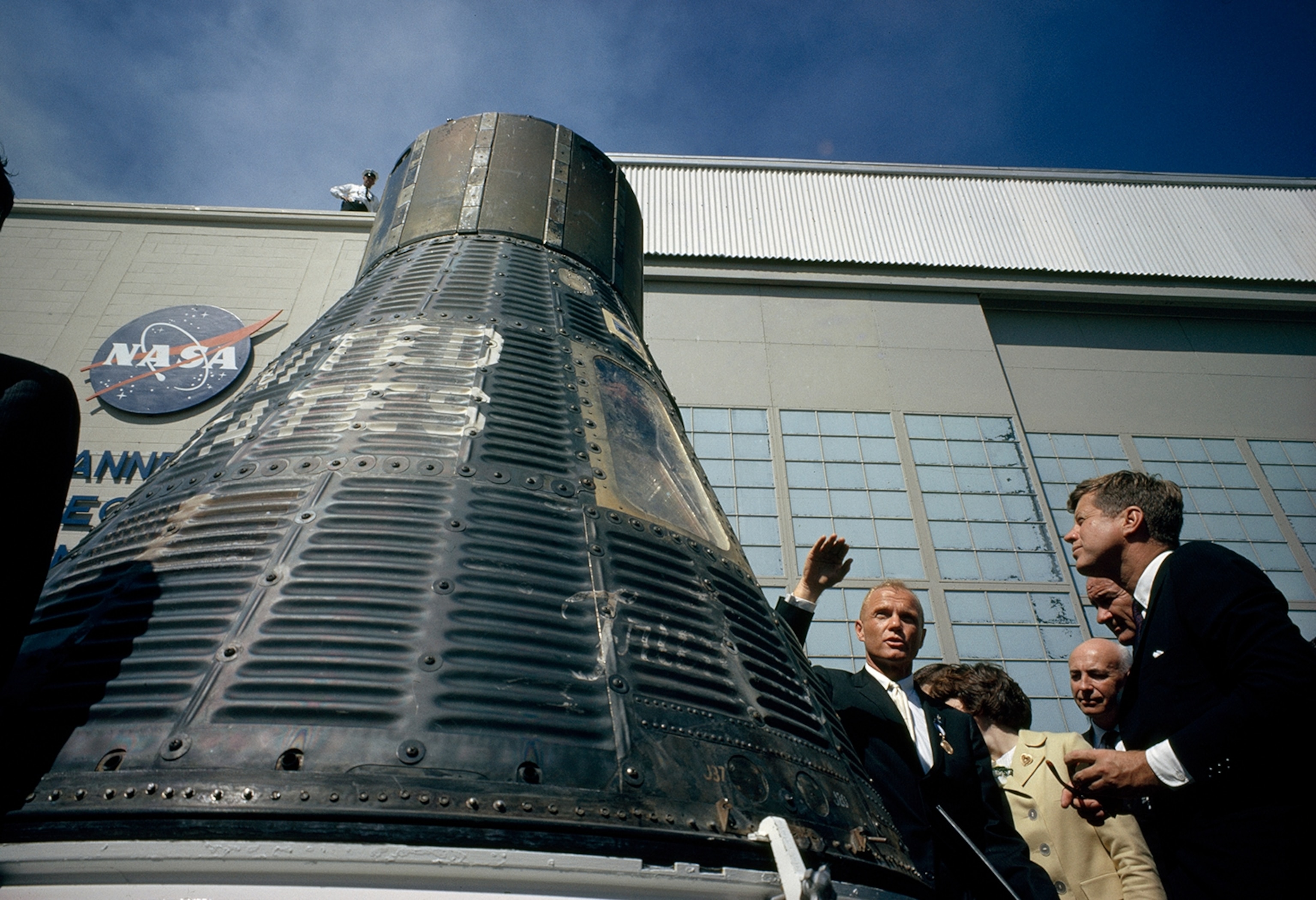 Kennedy and John Glenn viewing the capsule