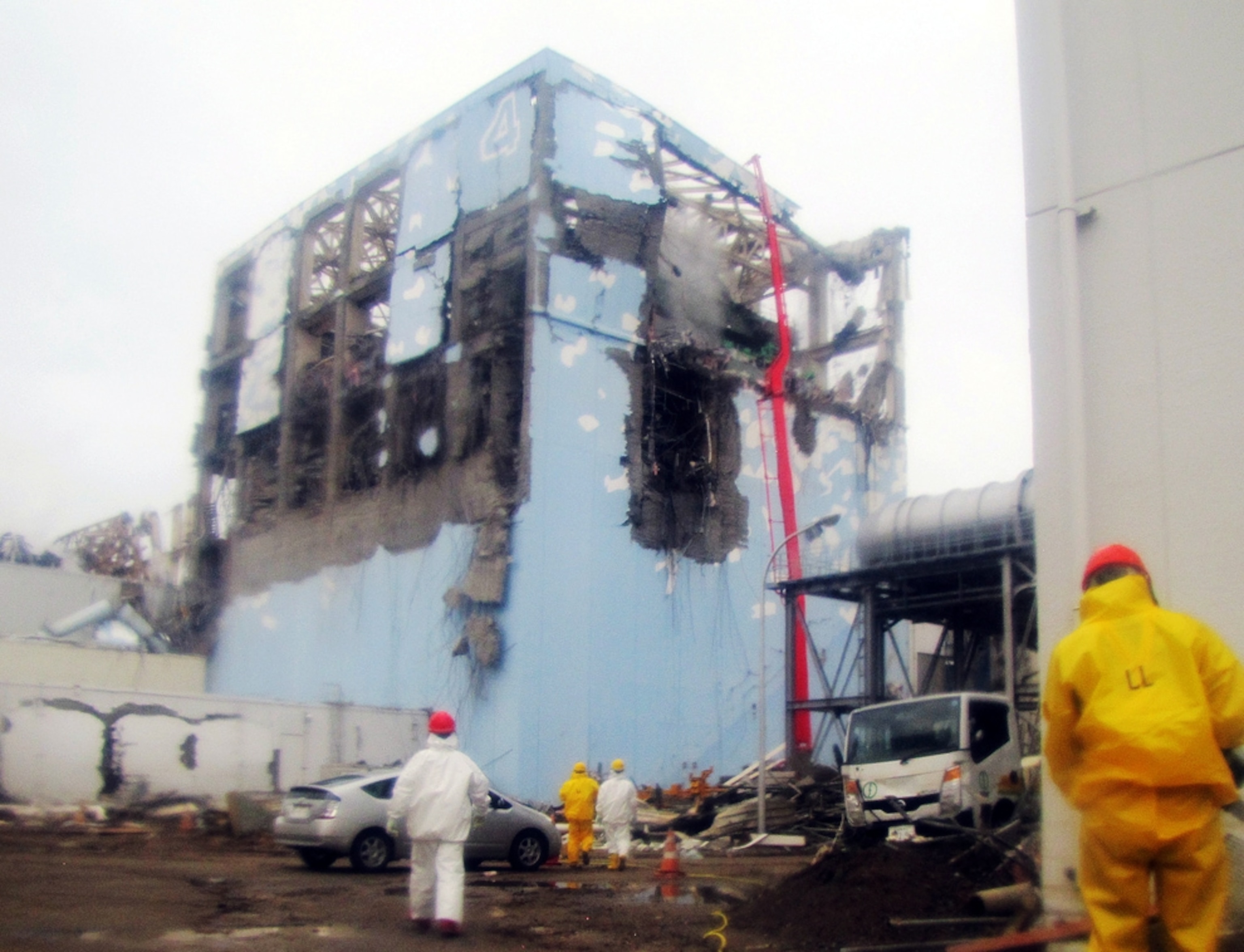 Workers cool a damaged nuclear reactor at the Fukushimi Daiichi nuclear power plant in Japan.