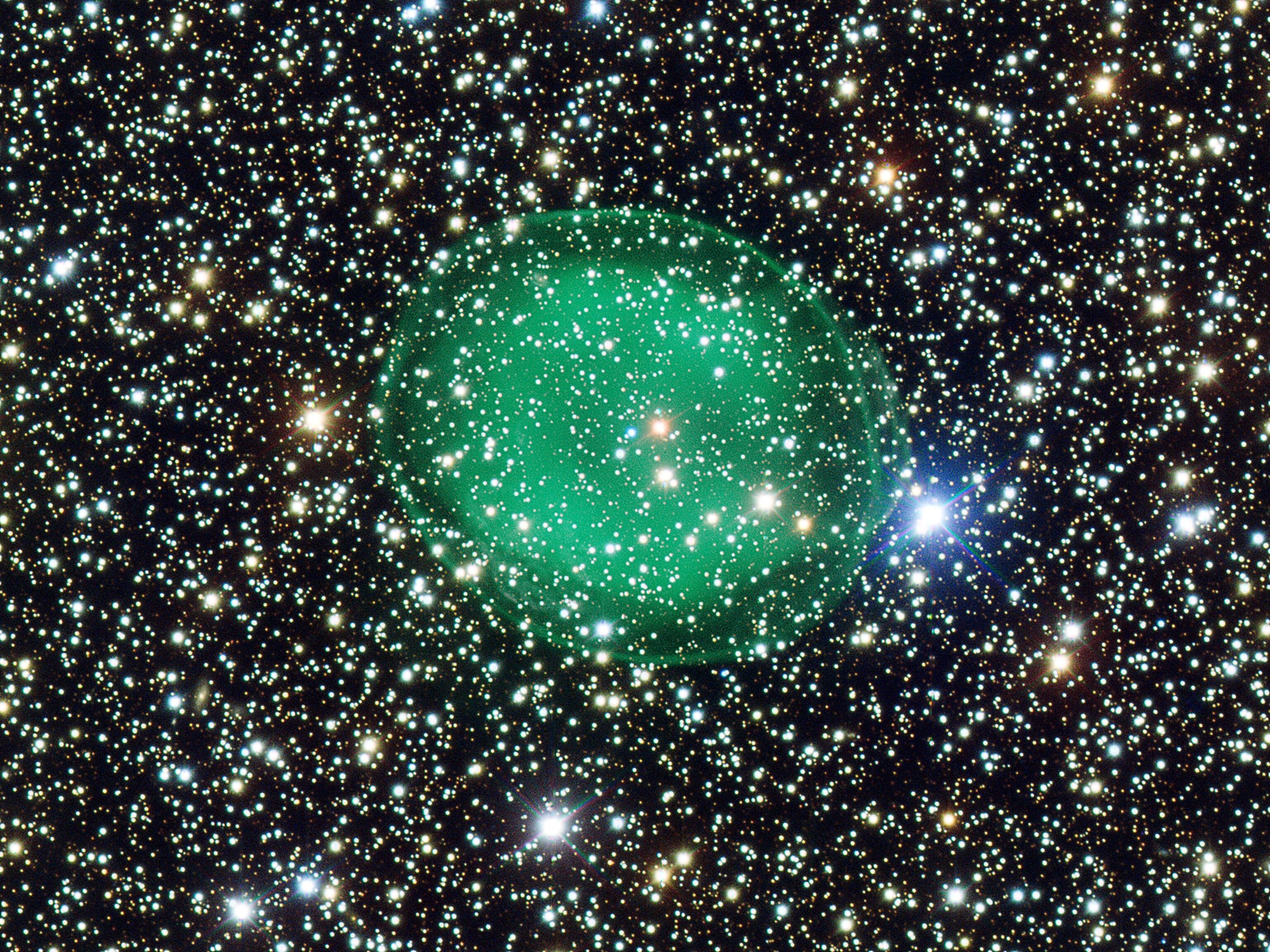 nebula IC 1295 surrounding a dying star in the constellation Scutum, or Shield