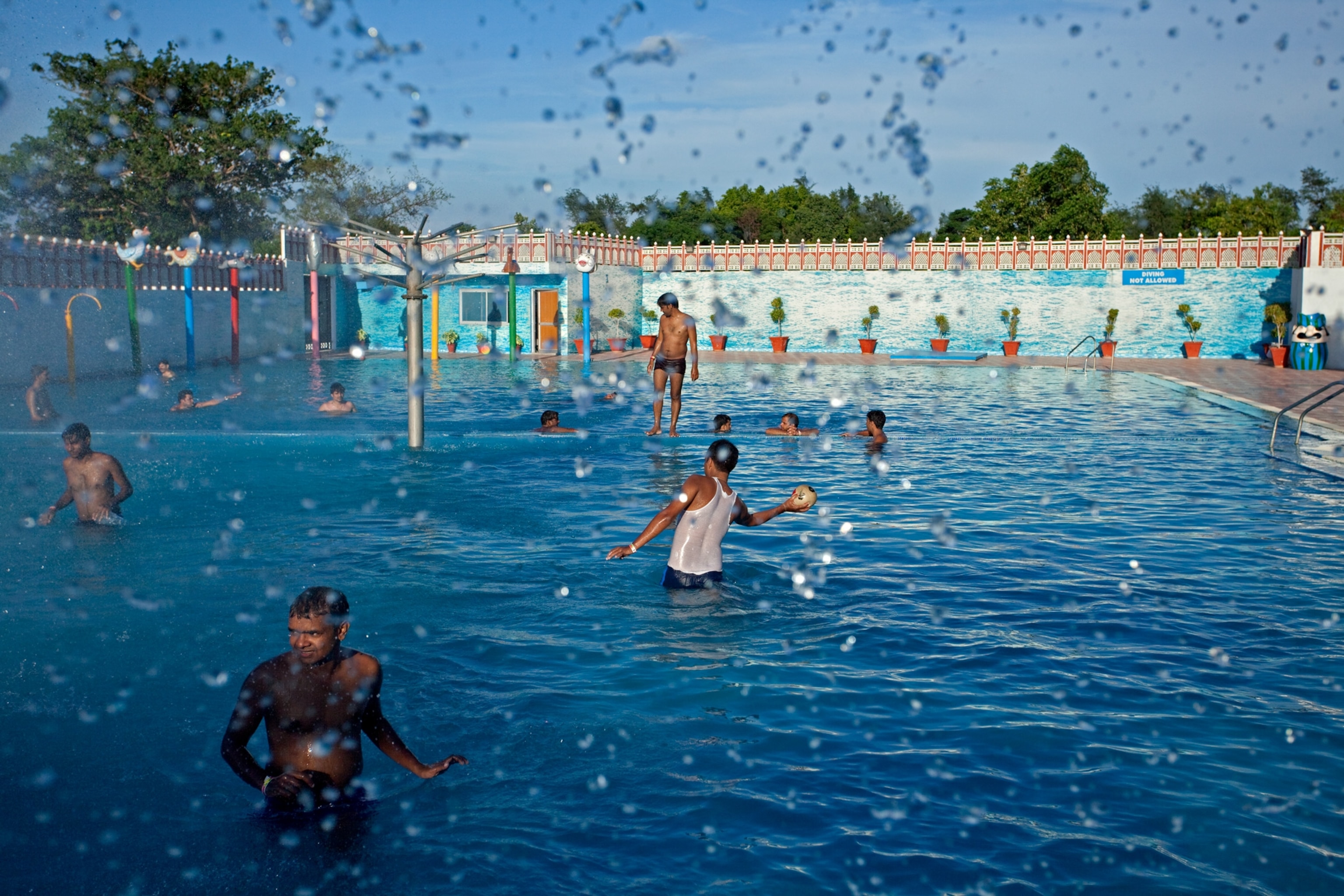 people cooling off at a water park in Delhi
