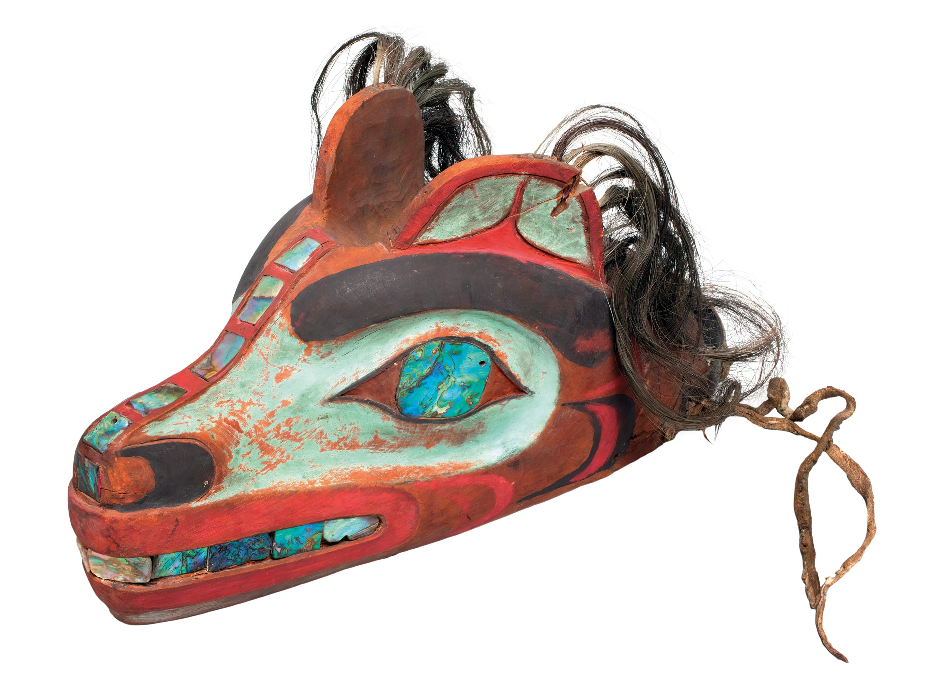 Tlingit wolf mask, made of painted wood, seashells, and human hair.