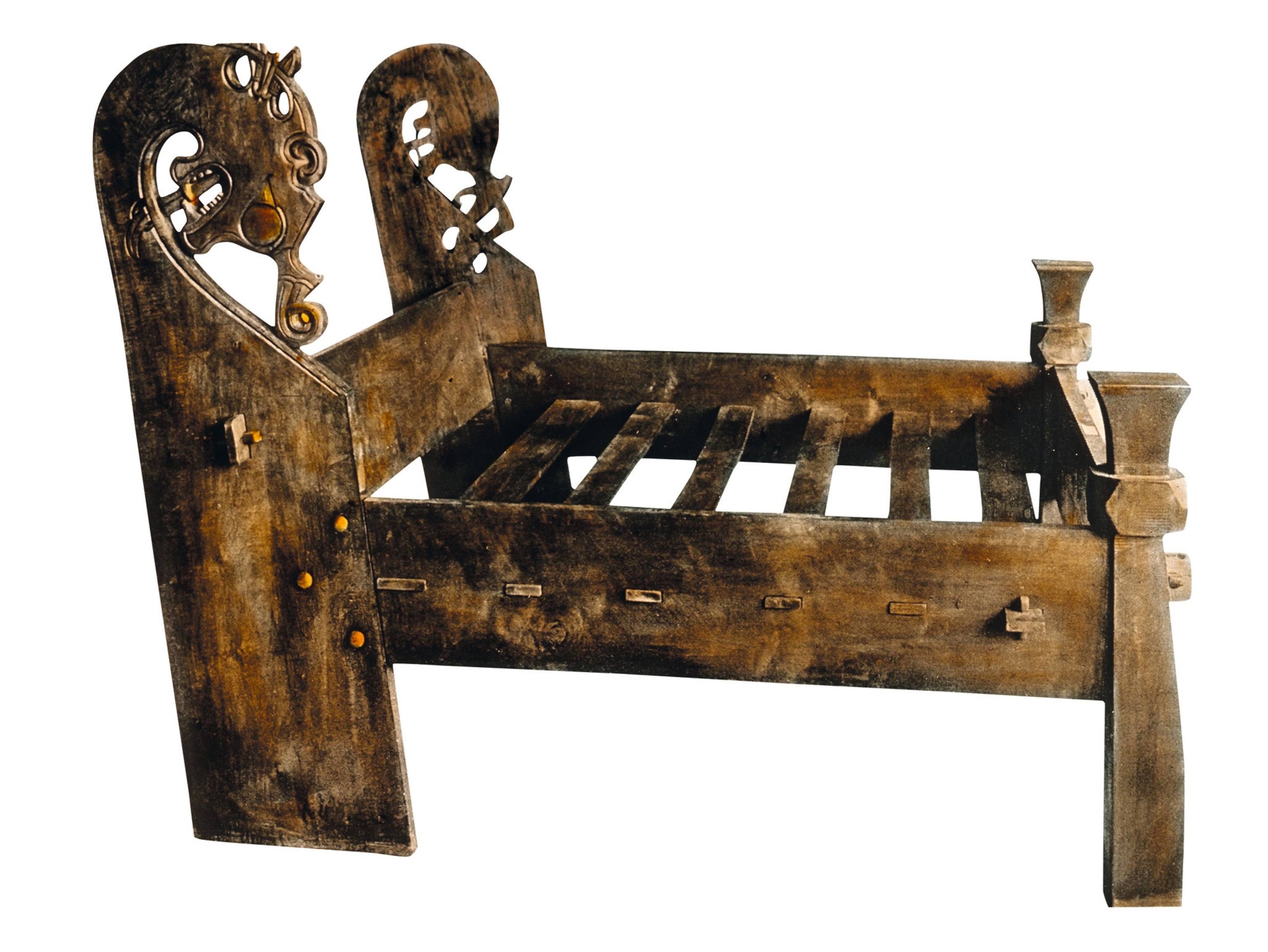 An adult bed measures just under five and a half feet long and has carved headposts in the shape of stylized animal heads.