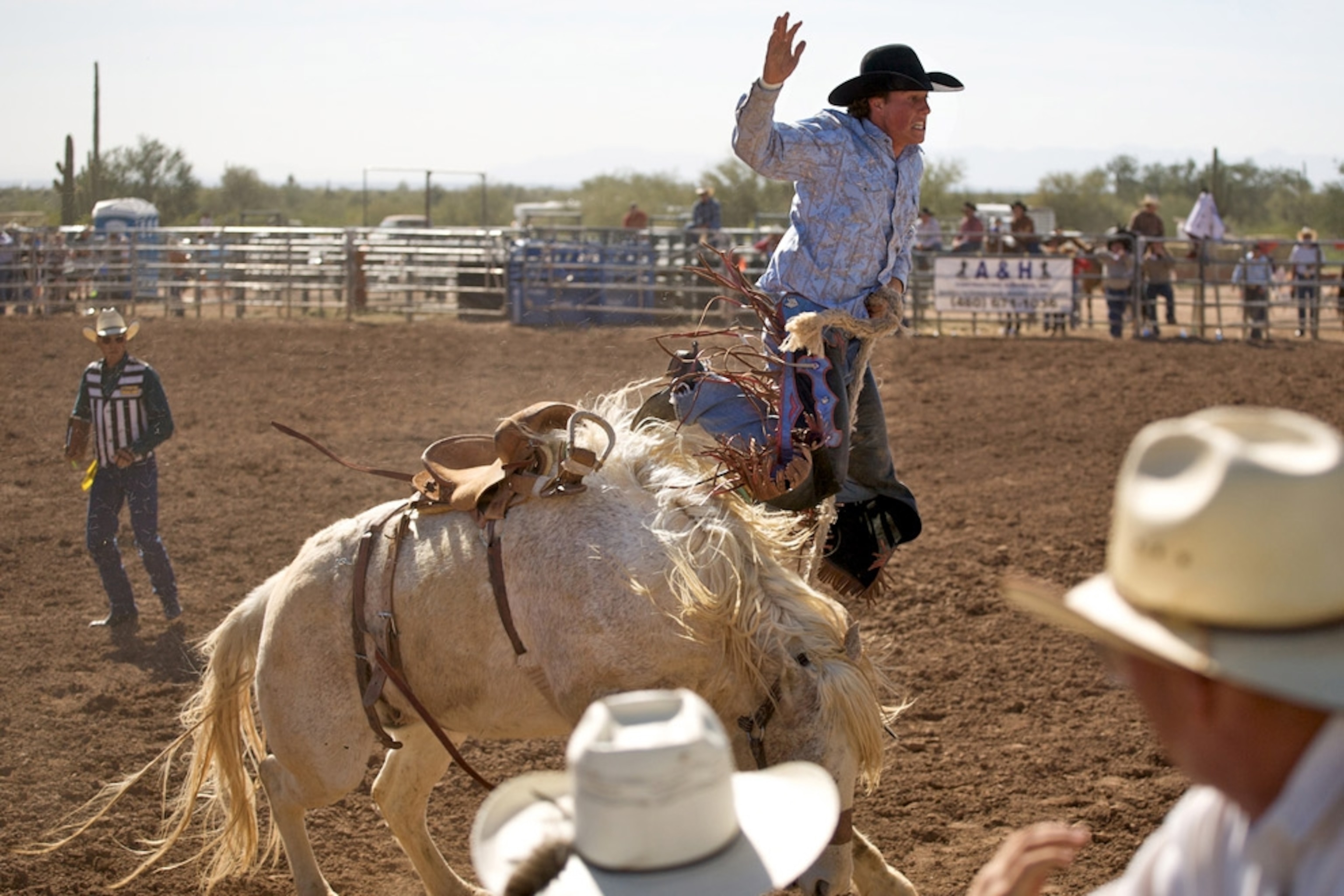 A man being thrown from a bronco