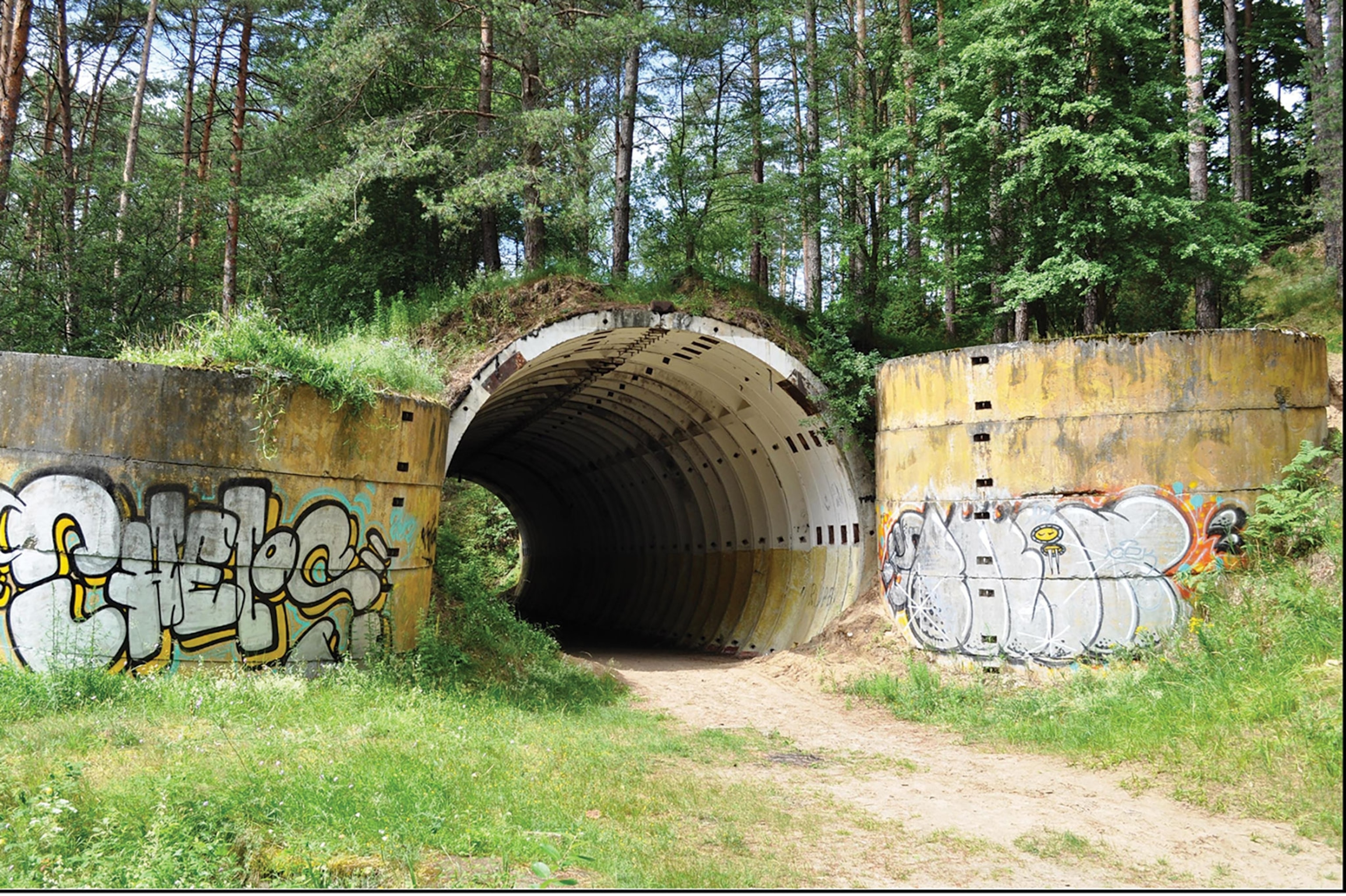 a granite Cold War bunker with graffiti on it