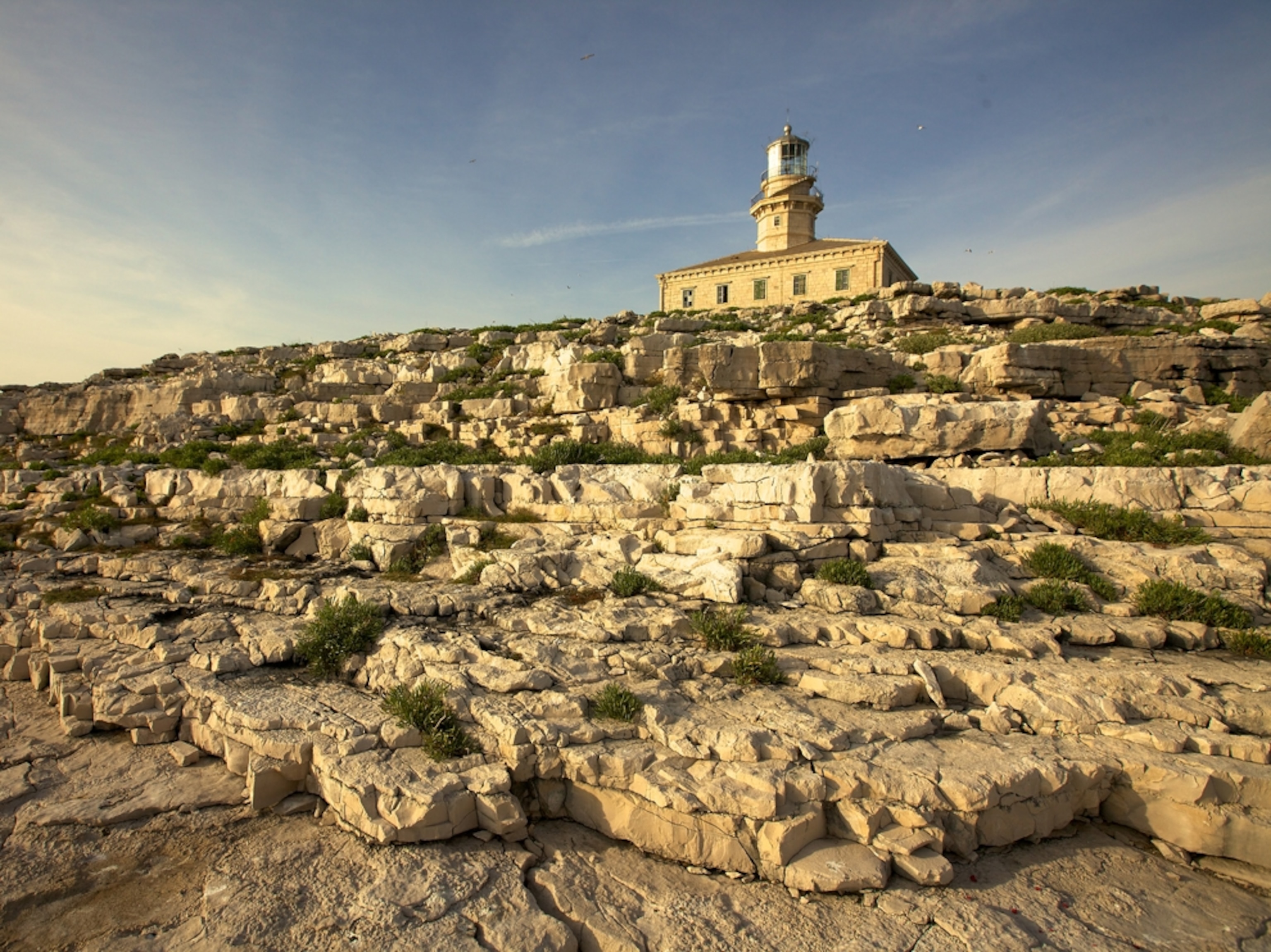 rocky hill Lastovo Island lighthouse