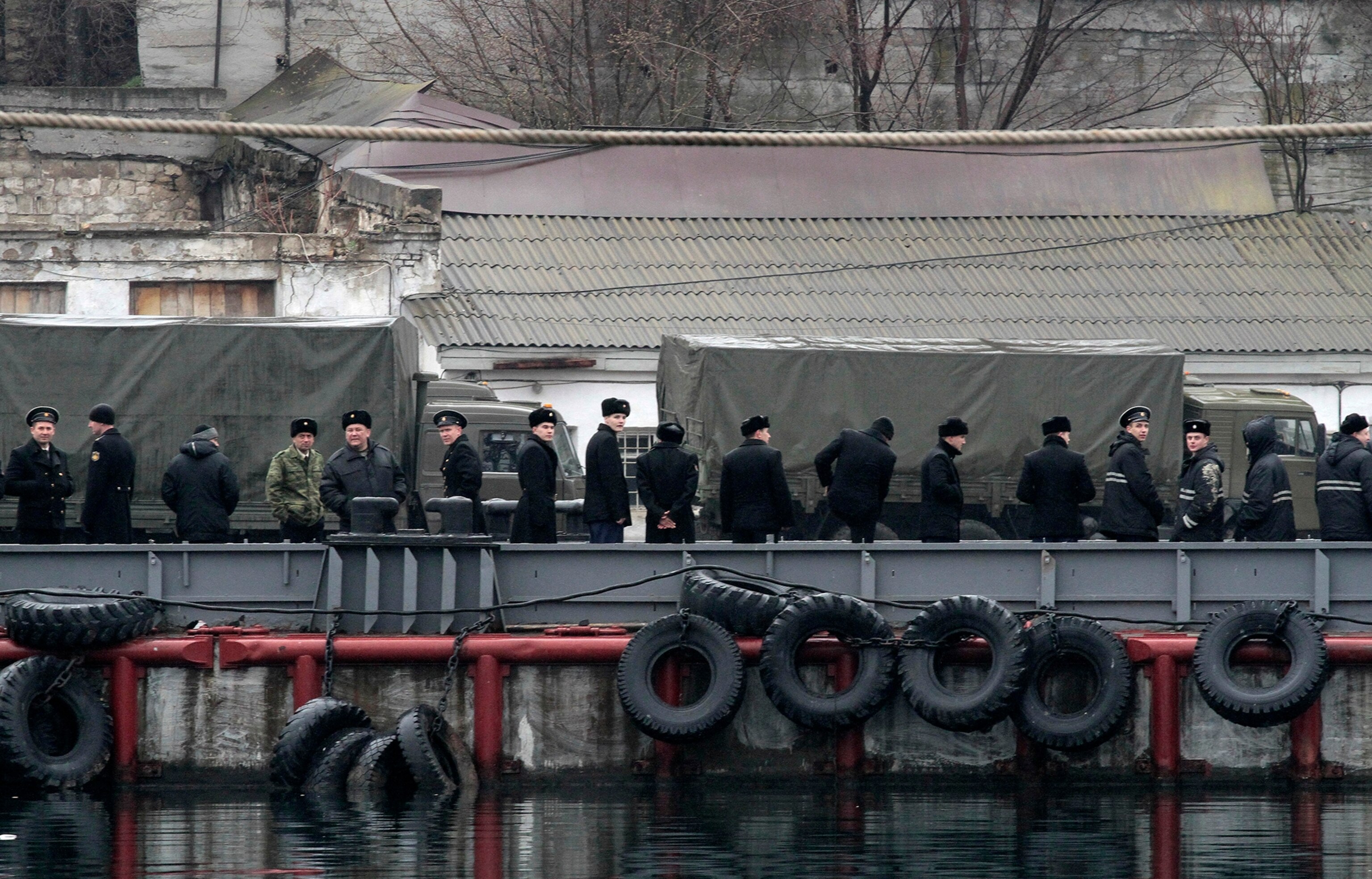 Unidentified armed men patrol outside of Simferopol airport, on February 28, 2014.