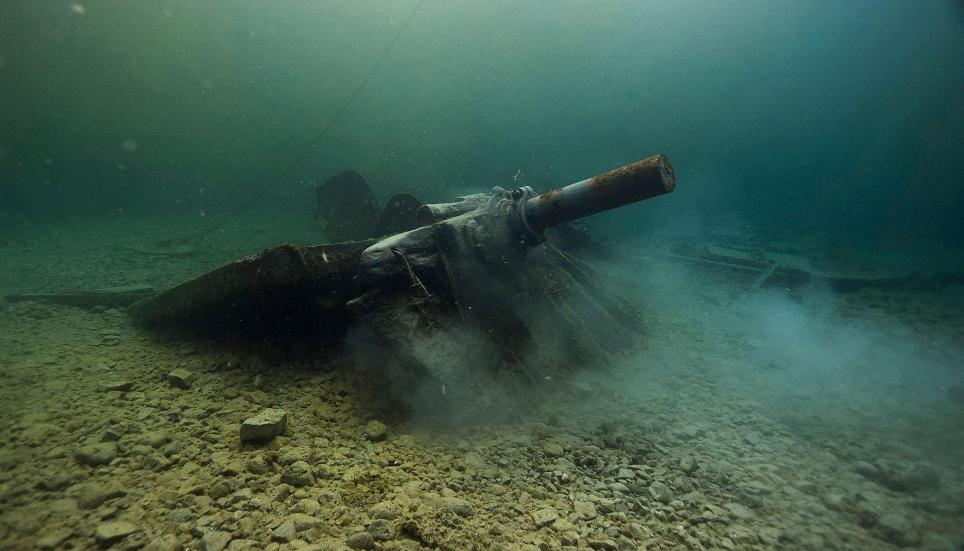 A shipwreck on a lake floor underwater