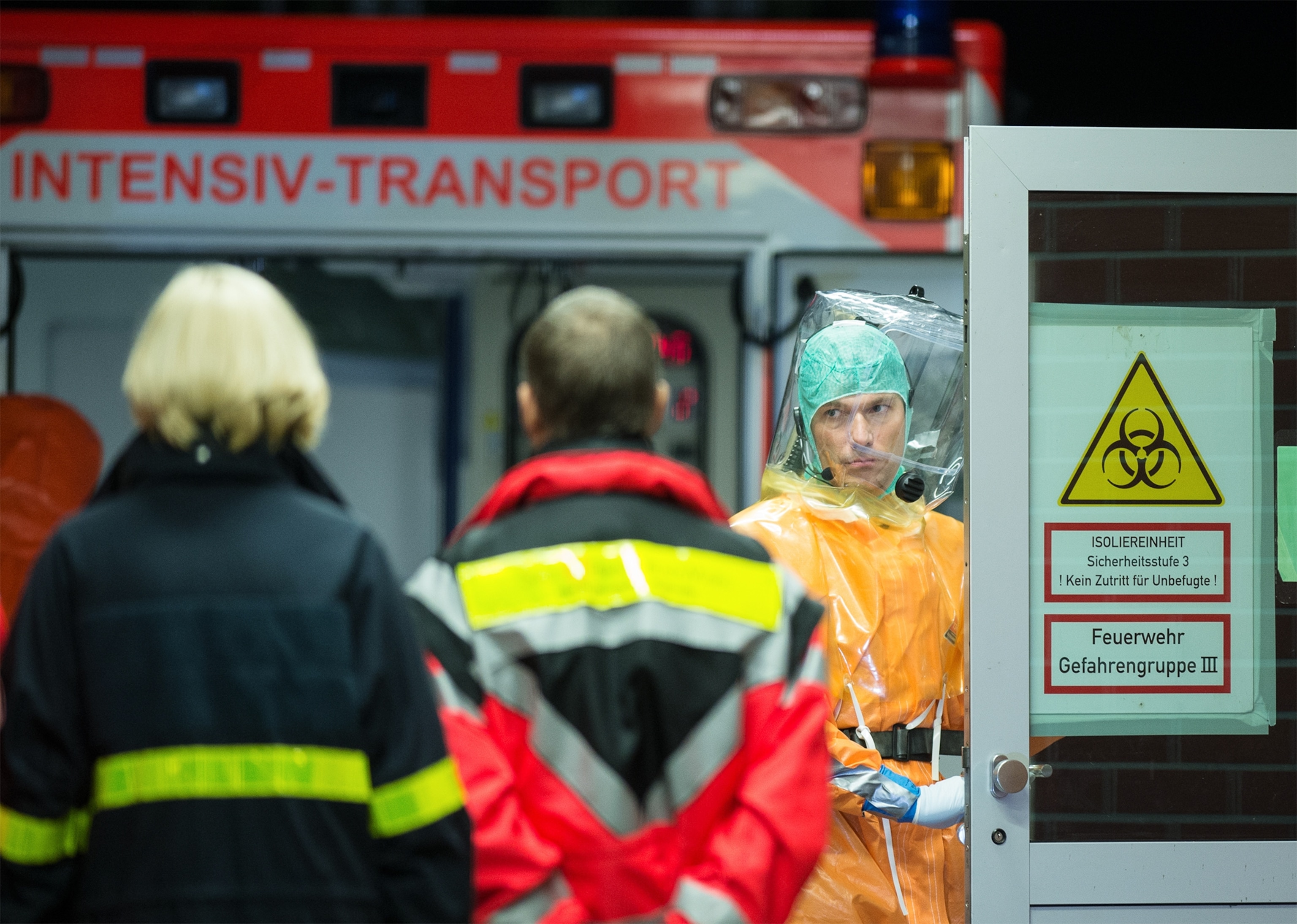 health workers putting on their protective clothing before visiting Ebola patients in Liberia.