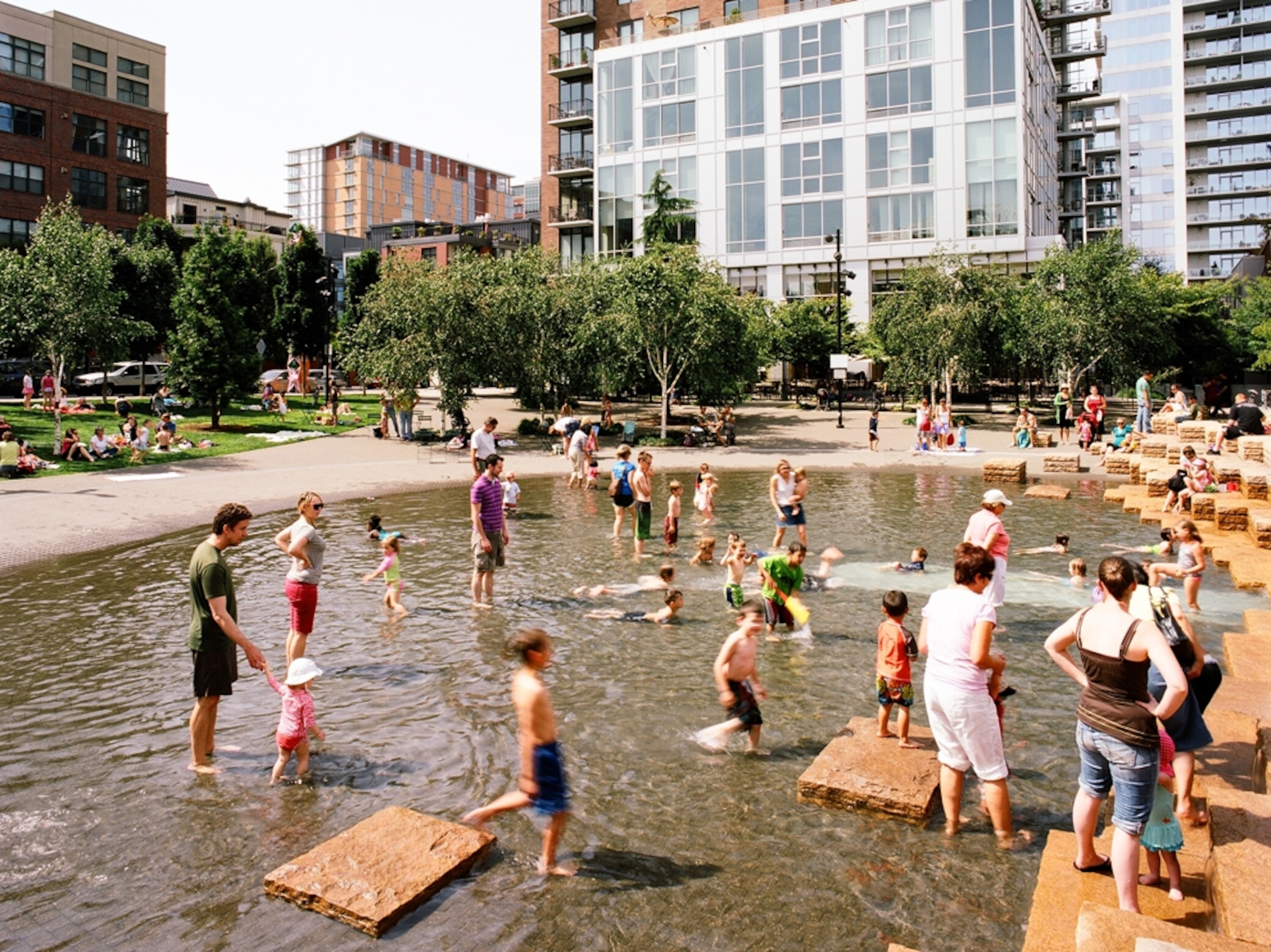 Children play in Jamison Square fountain, Portland, Oregon
