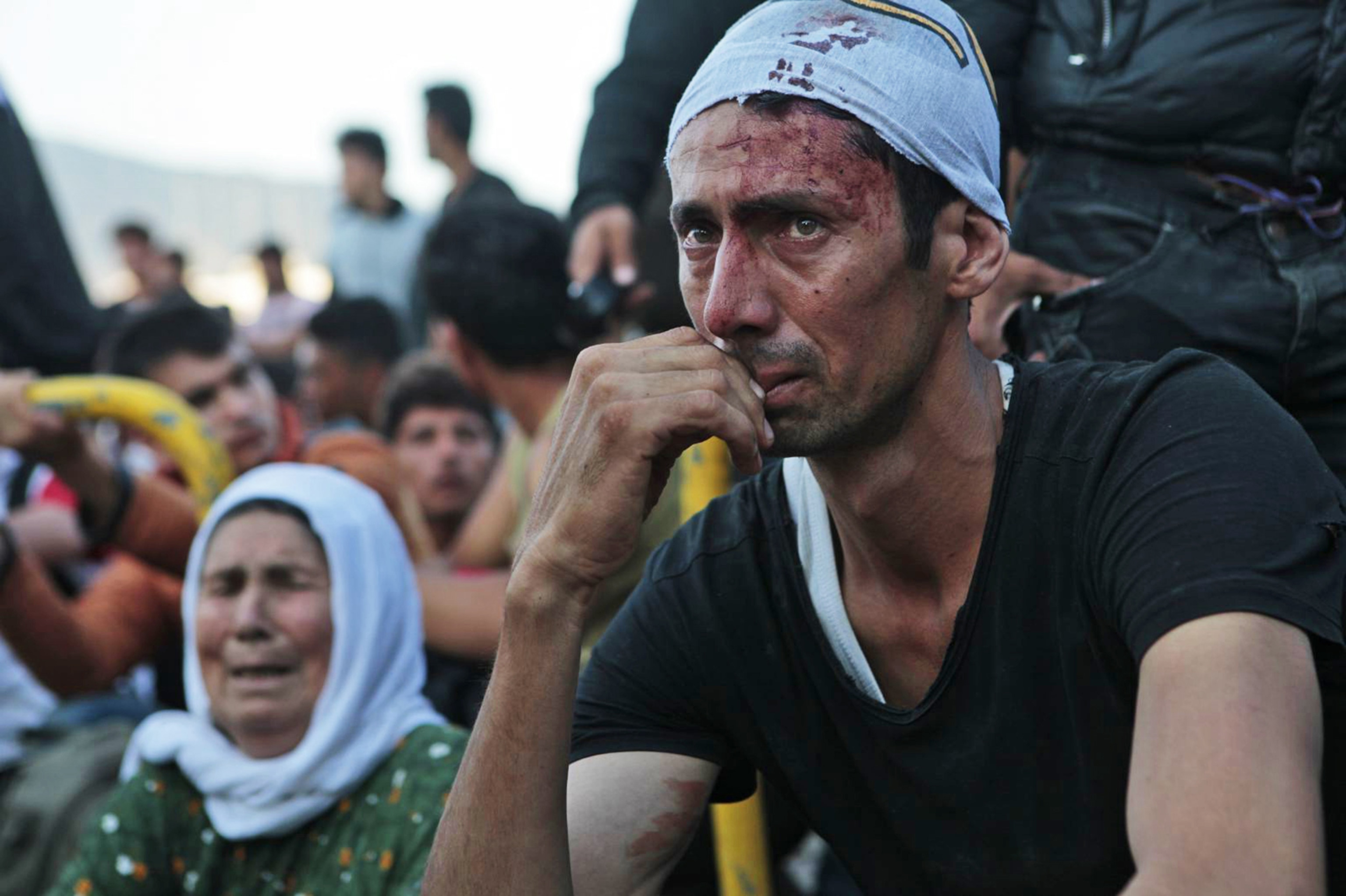 injured Afghan refugee at the port of Mytilini