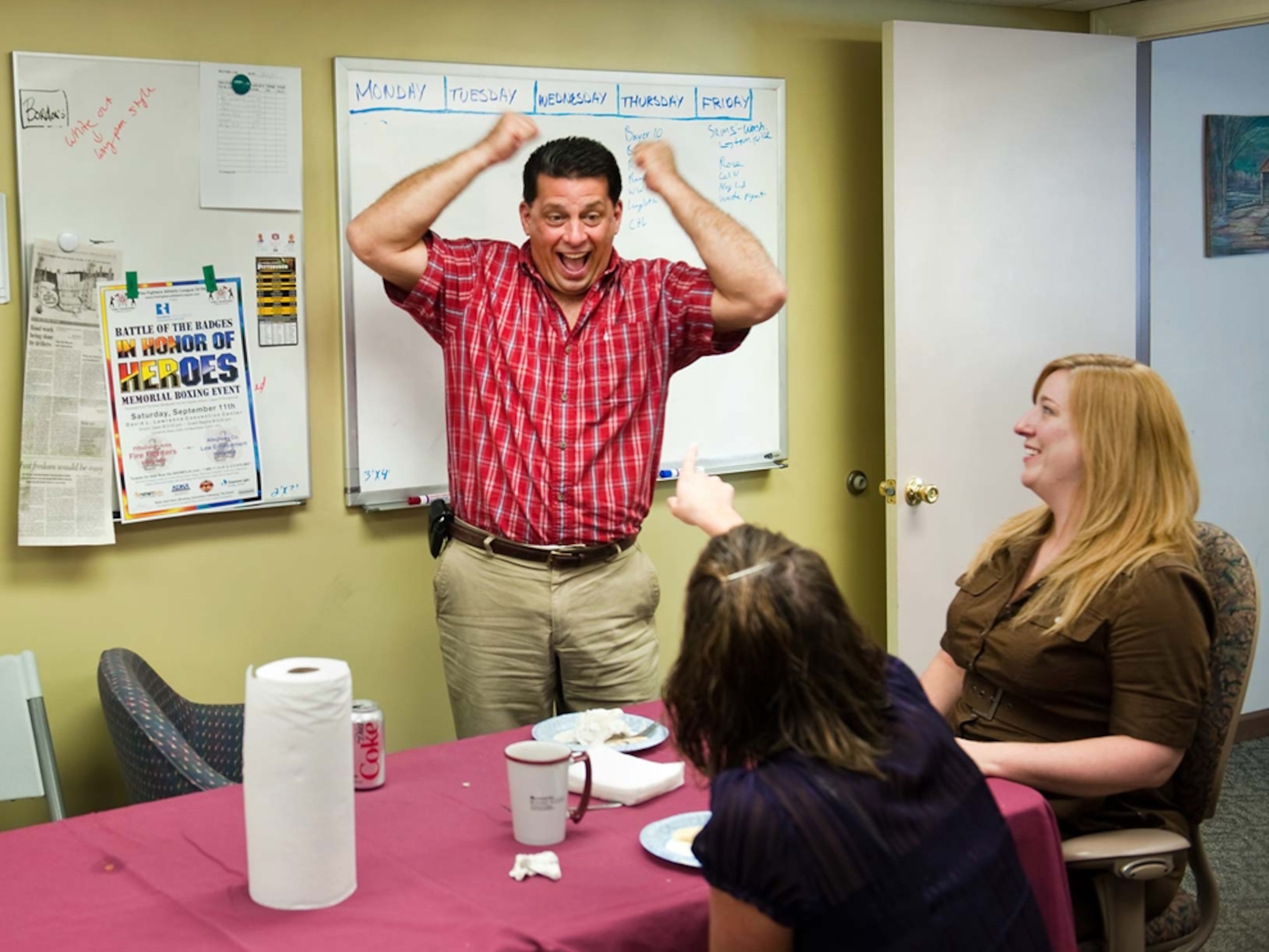 Sunnyside Supply owner Paul Battista, whose store services the gas industry, leads a staff meeting.