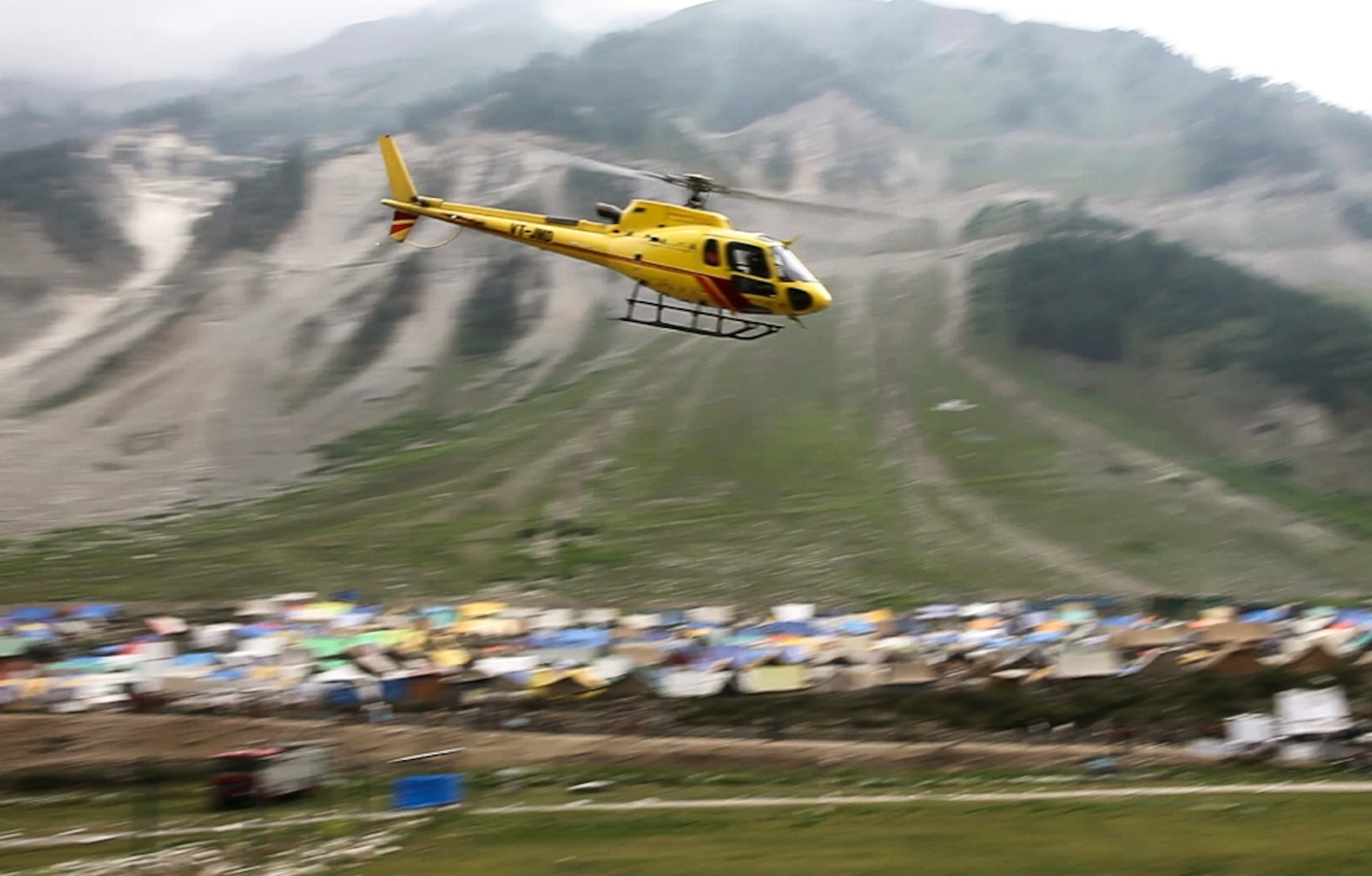 A helicopter takes pilgrims to the Amarnath cave during the Amarnath Yatra in Kashmir.