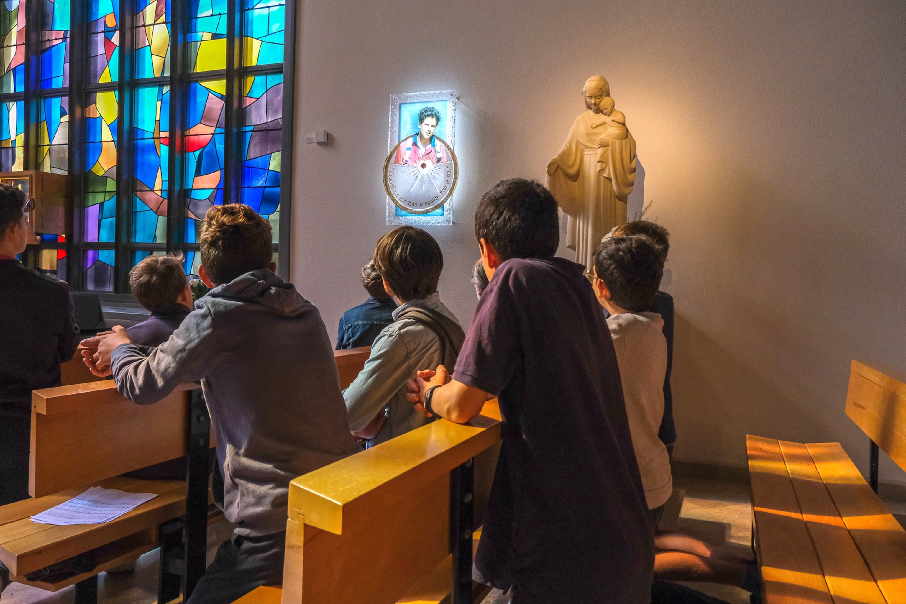 Young students attend the relic installation mass for Carlo Acutis at the Lycee Notre-Dame de la Galaure.