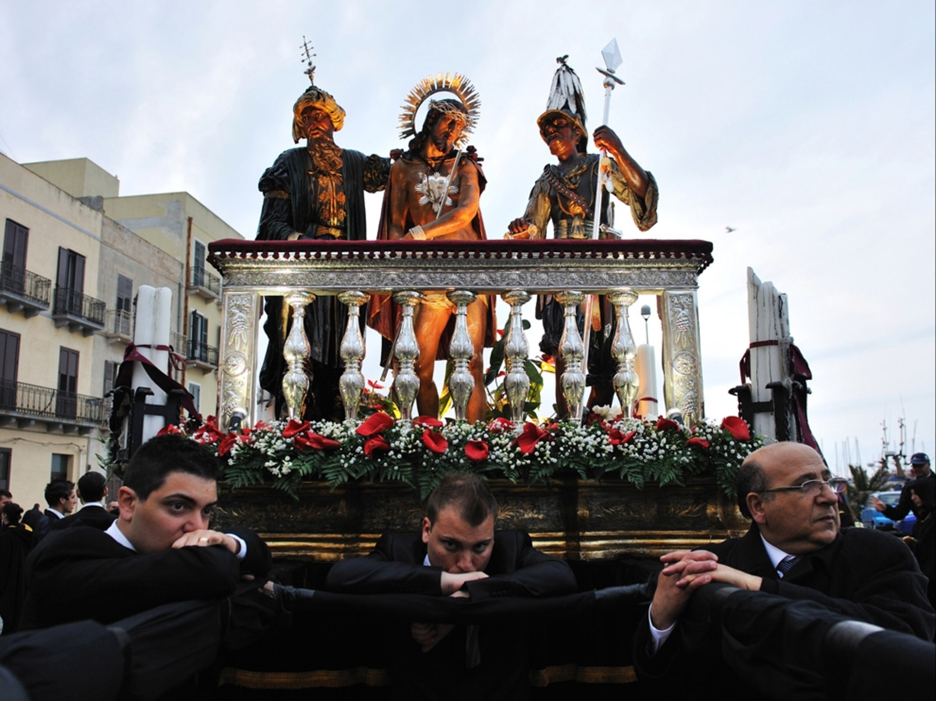 Devotees taking a break from an Easter celebration in Italy