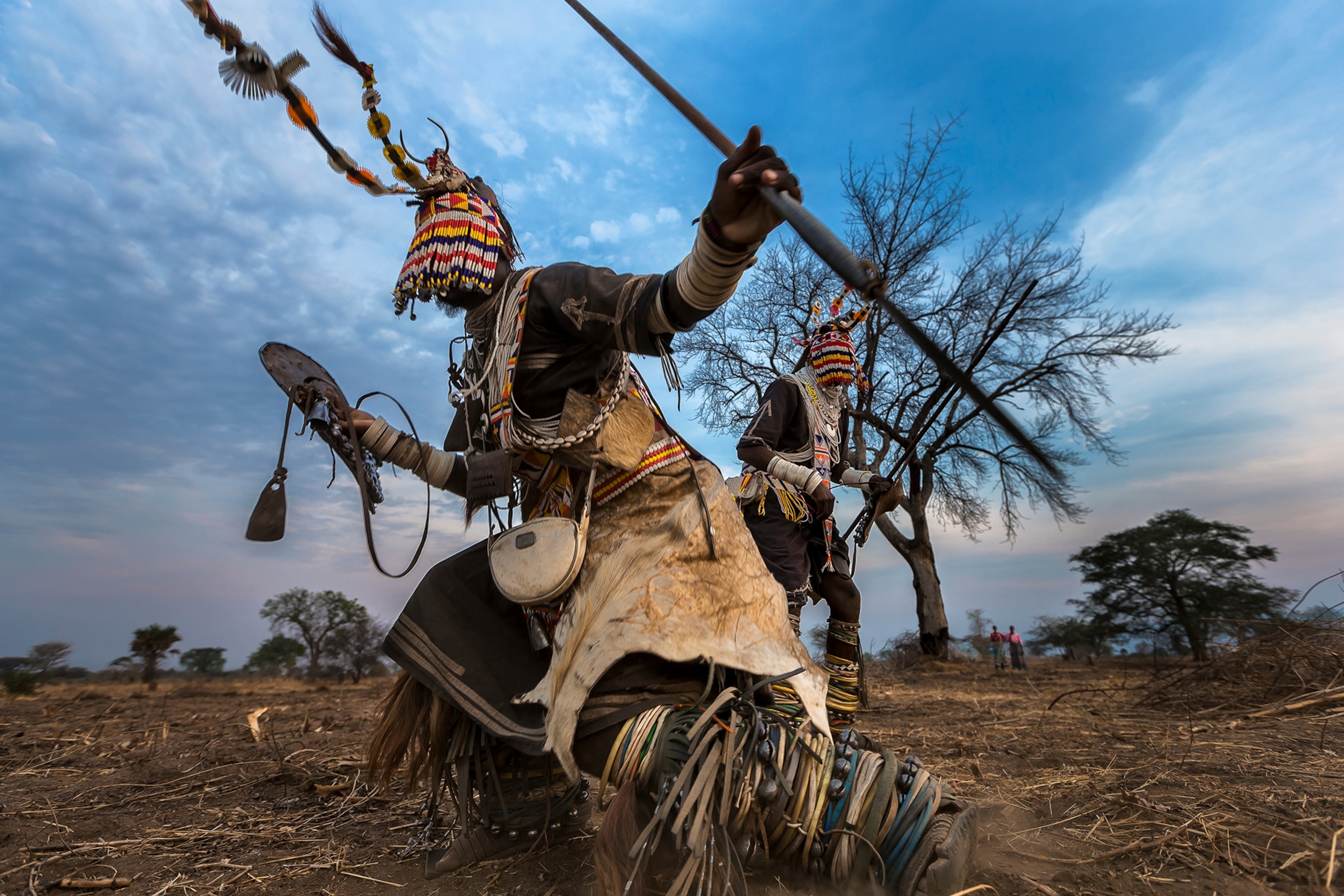 Lion dancers from the Sakuma tribe perform the story of their lion-killing outside a village in western Tanzania.