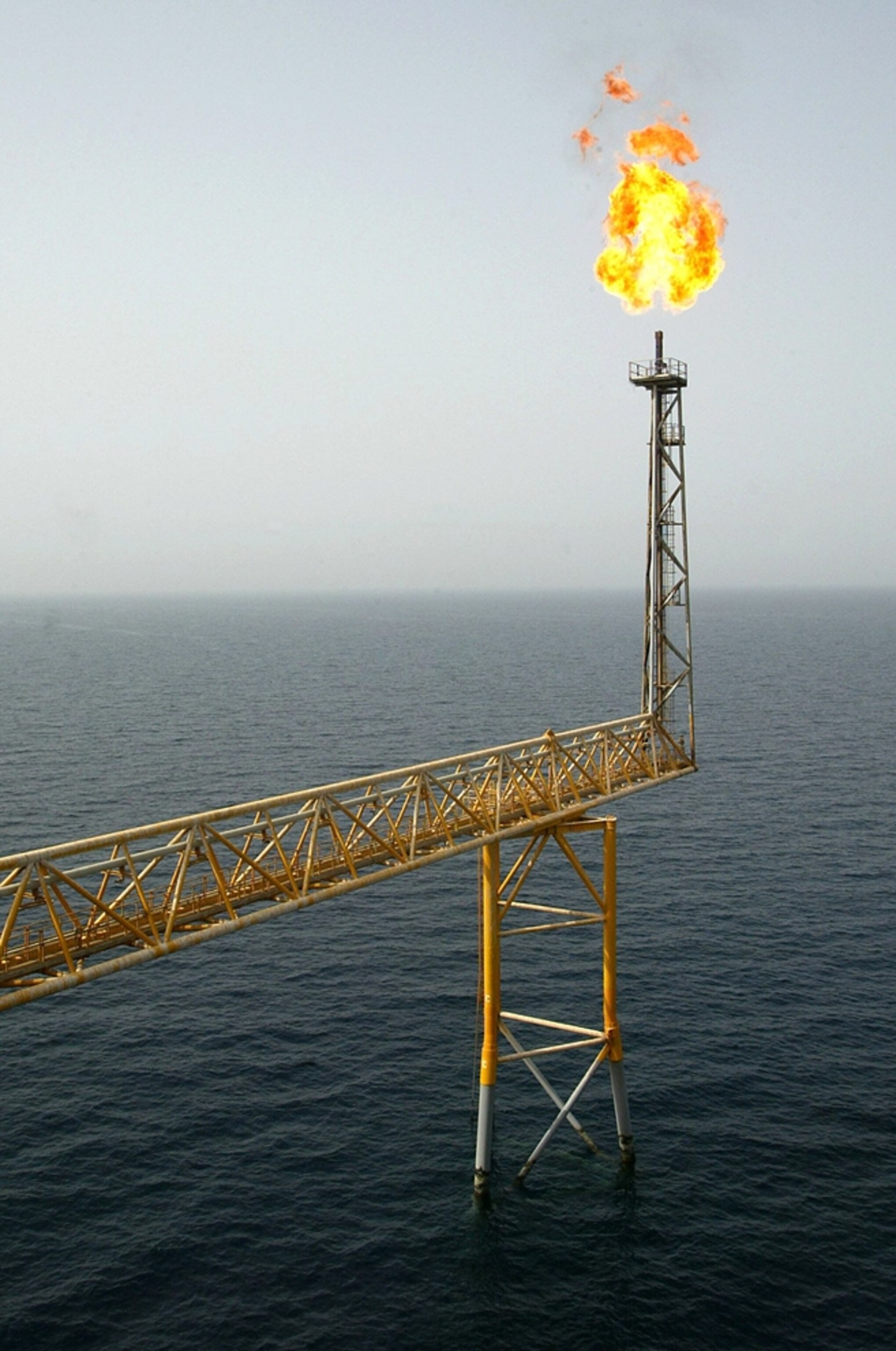 A flame rises from the Balal offshore oil platform near the Qatari coast picture.