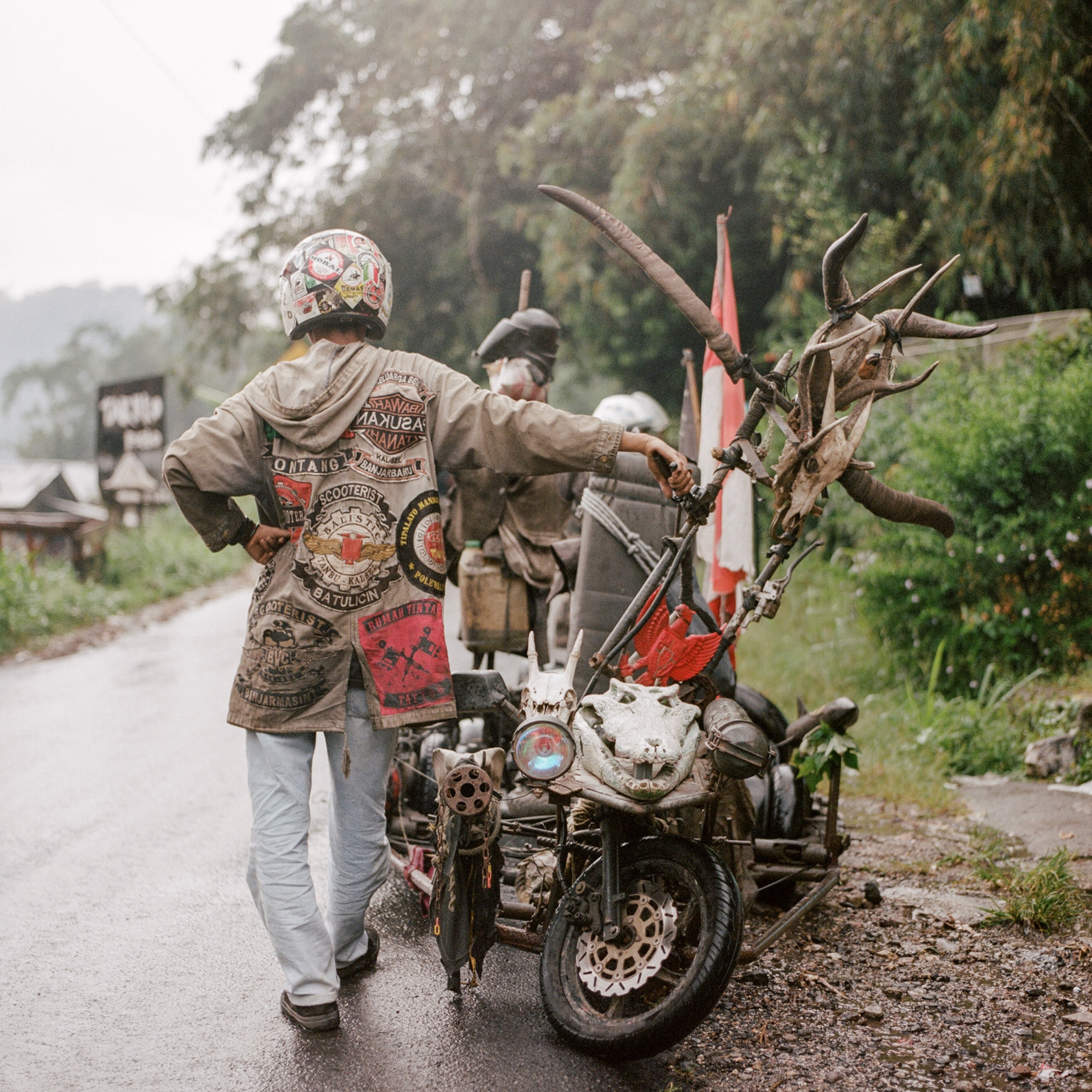 a person with his scooter in Indonesia