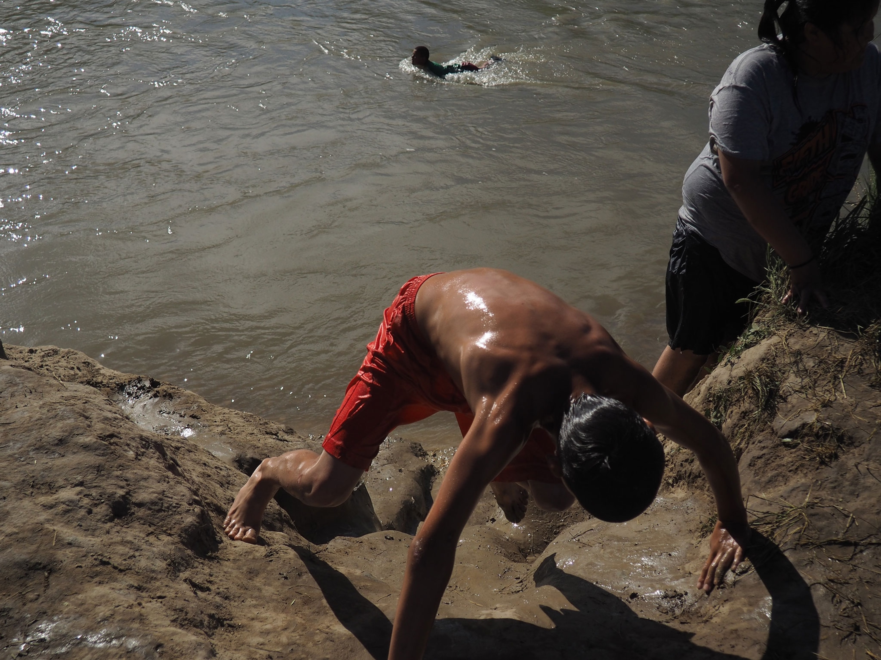 boys swimming in a river on the Crow Indian reservation