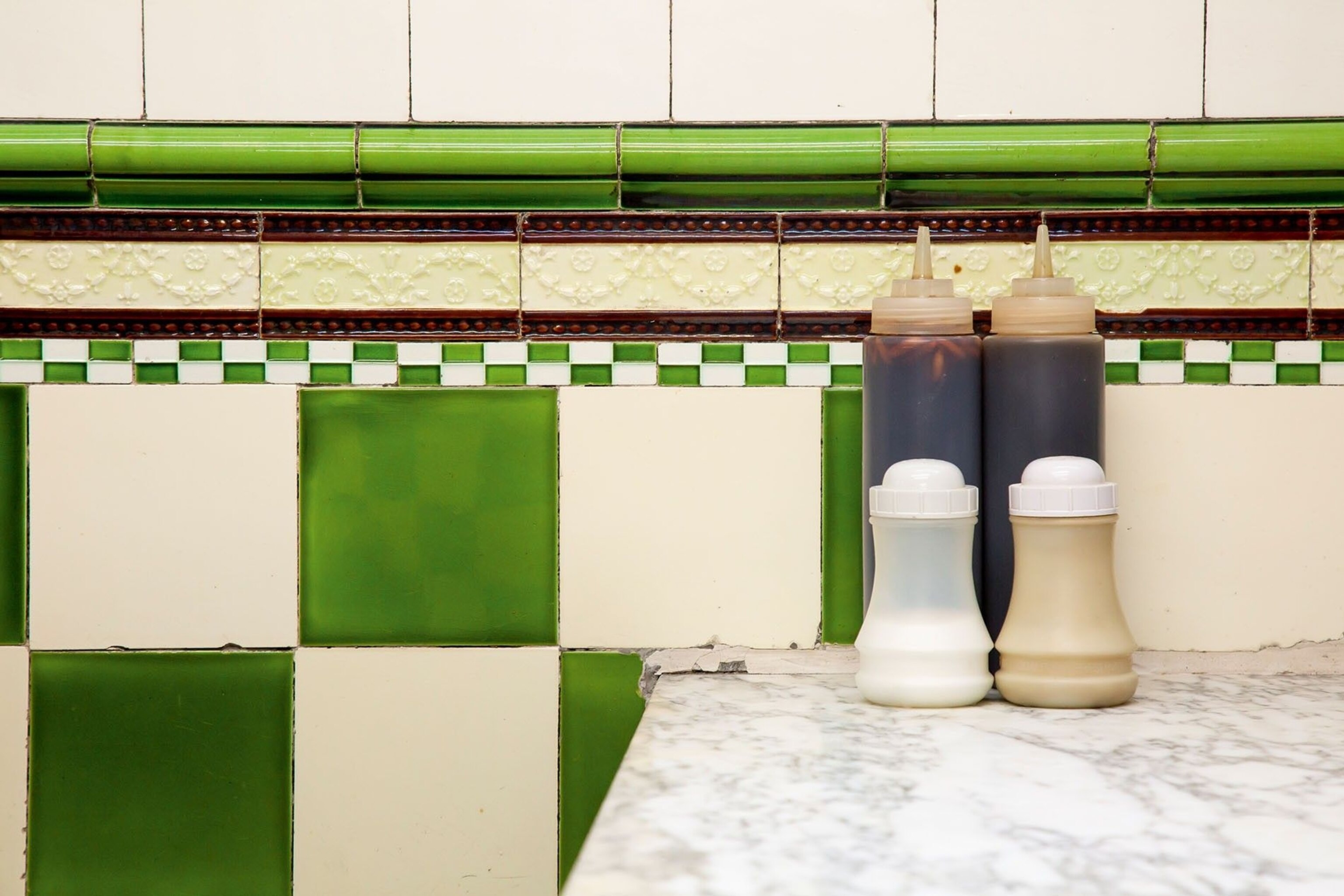 The archetypal Pie 'n' Mash aesthetic of tiled walls and marble surfaces