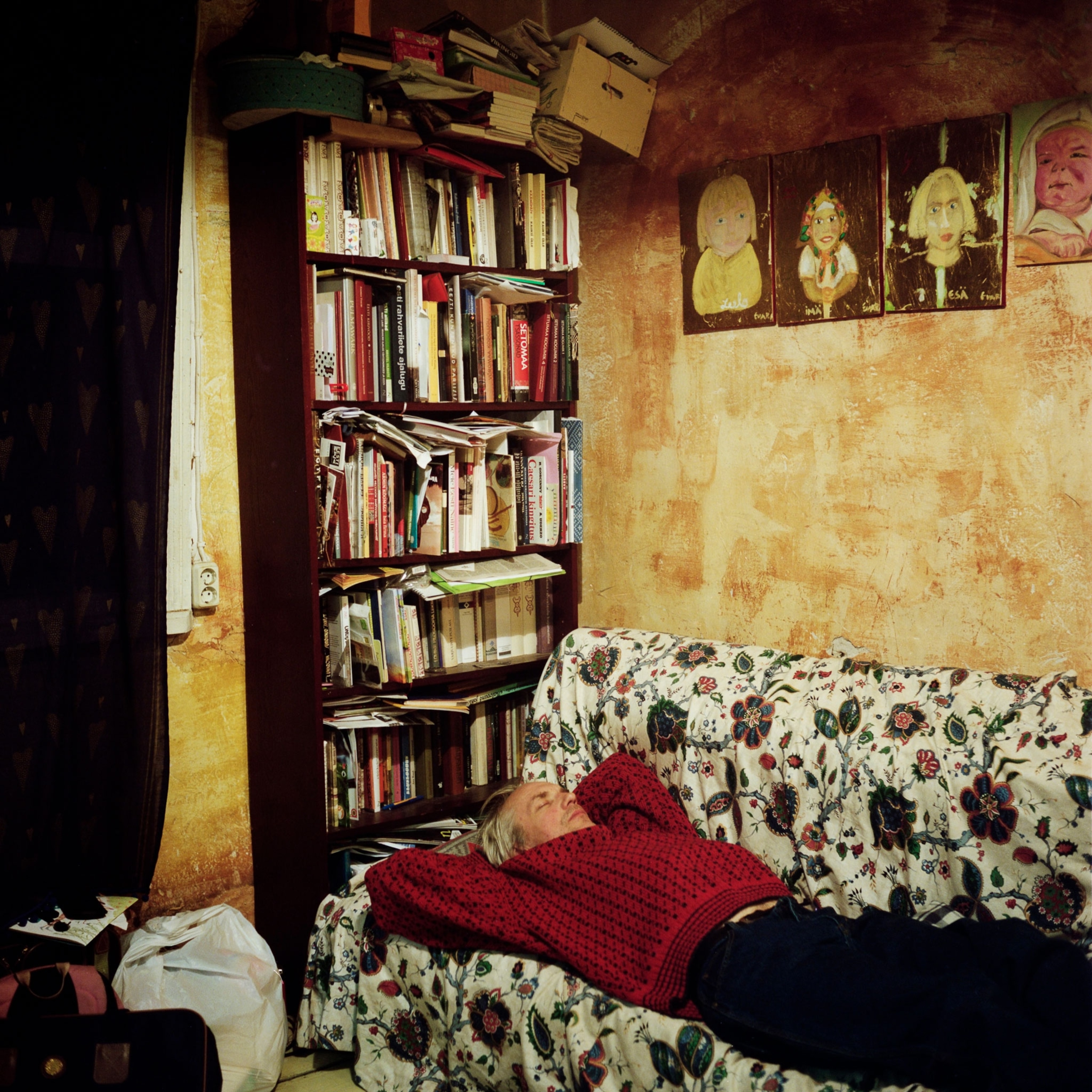 a man laying on his couch