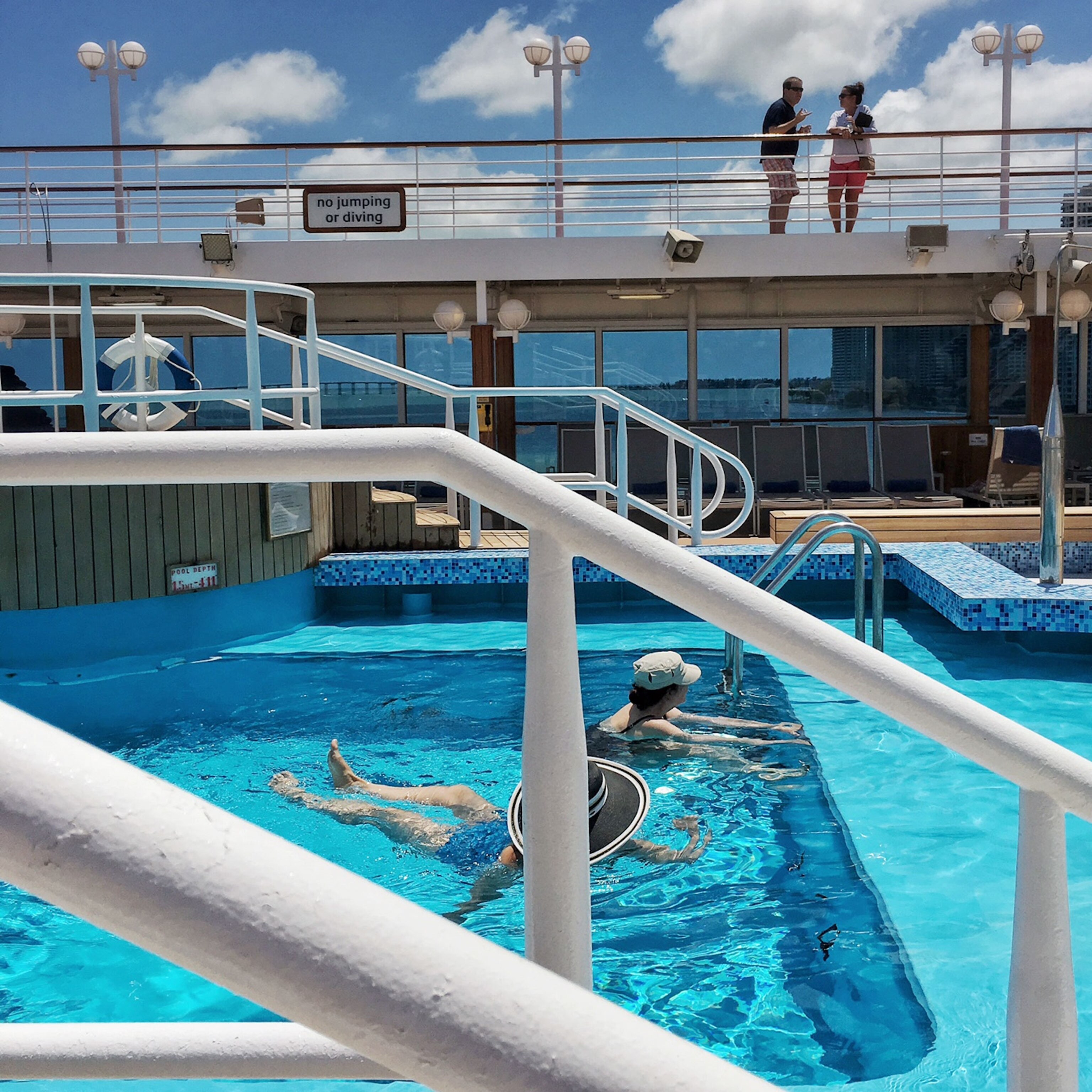 passengers swimming on a cruise ship