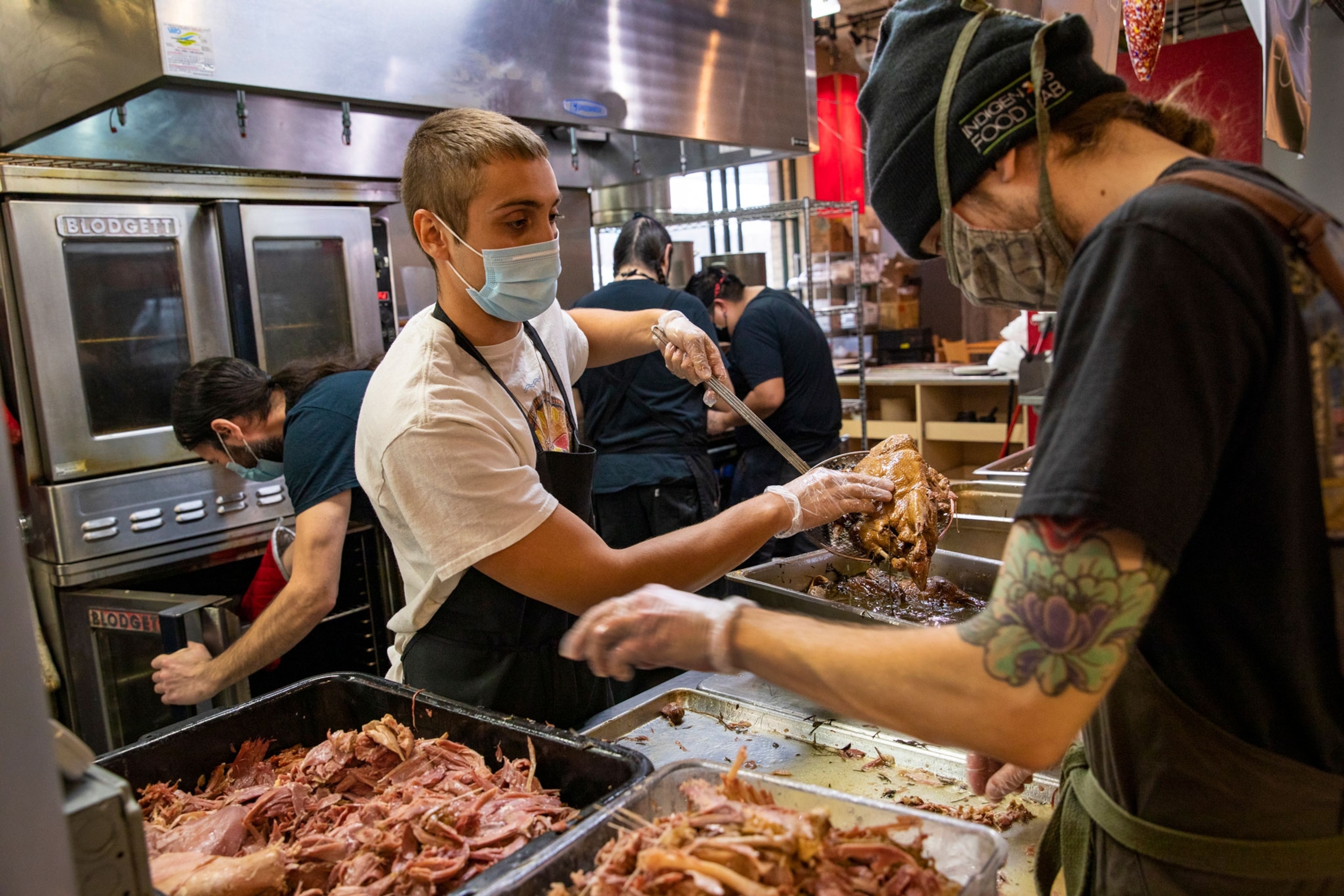 Chefs prepare Thanksgiving meals for homeless in Minneapolis, MN.