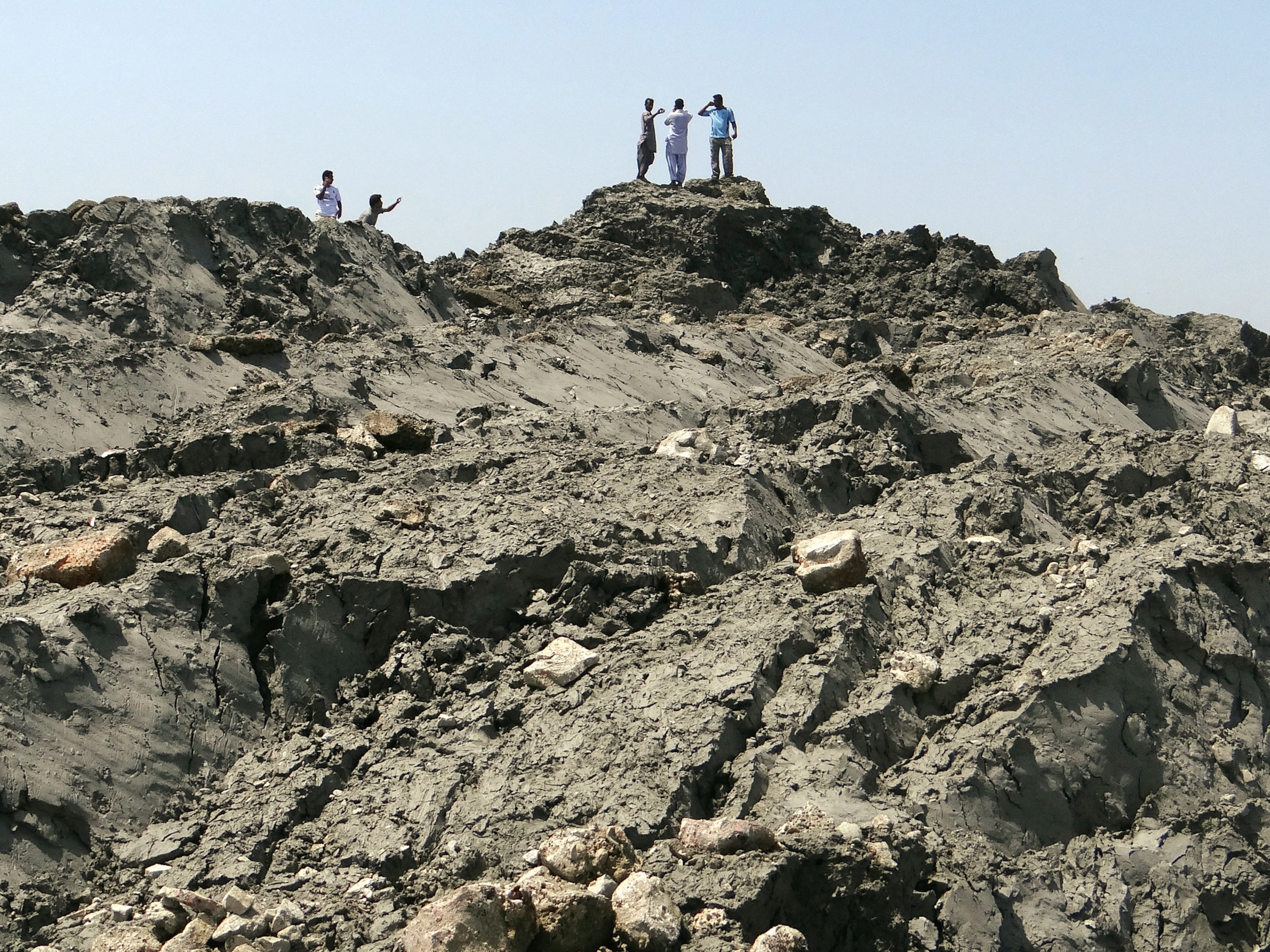People walk on an island.