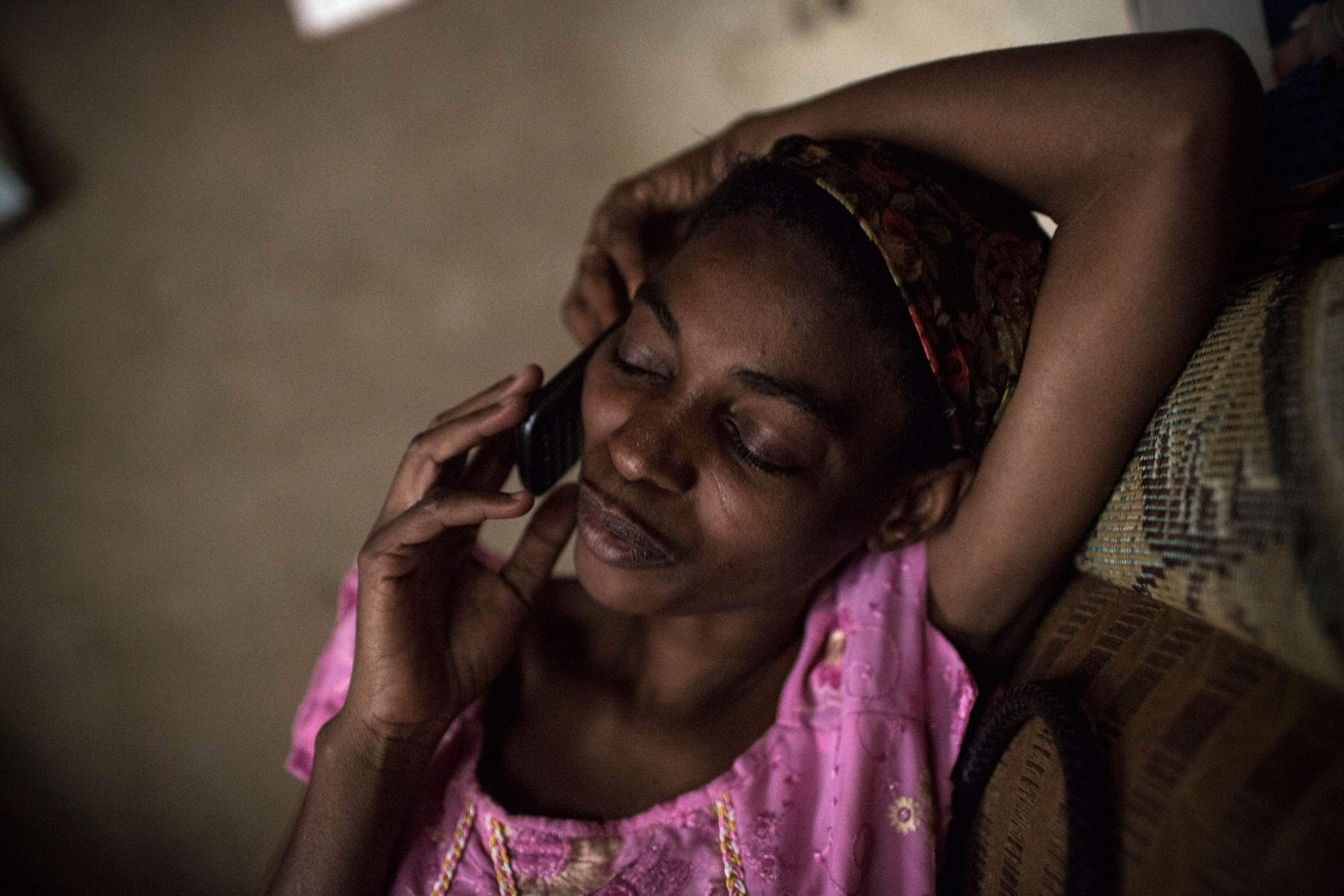 Rabi, a romance novelist in Kano, talks on the phone. All day and all night, her phones ring. She has three or four lines. She talked to suitors before she was married and continues to talk to her family and to readers who call her for advice on their marriages.