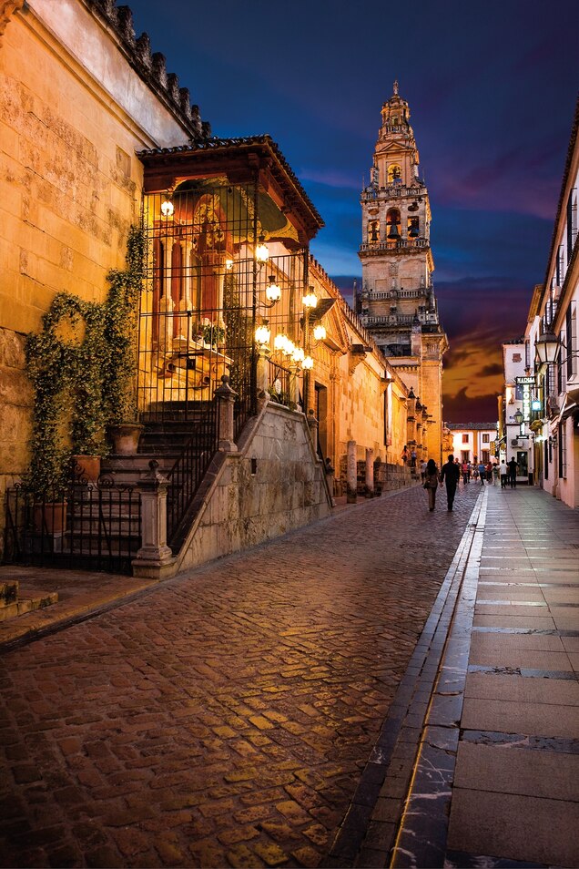 In the shadow of the mosque-cathedral’s bell tower along its north wall, the altar of the Virgin of the Lanterns is illuminated at night.