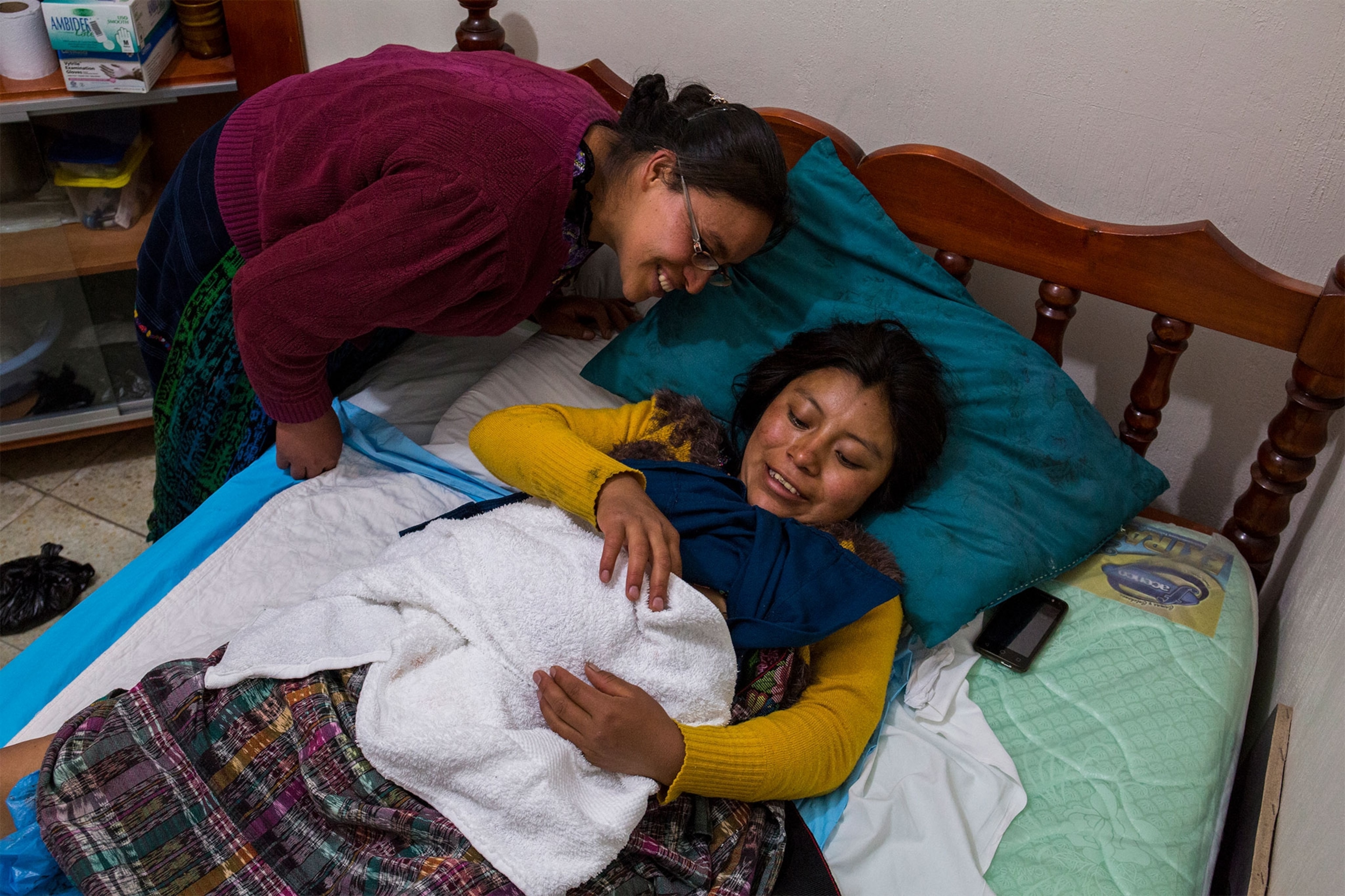 woman with her newborn baby