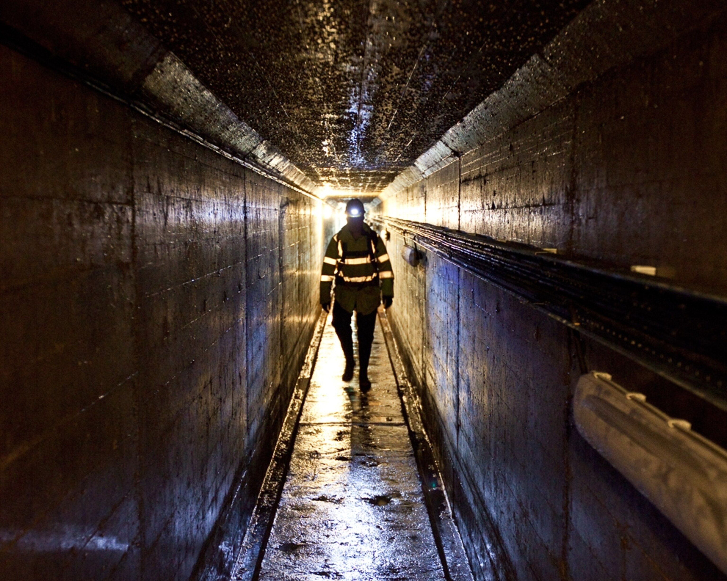 An engineer inspects the dam at Loch Breaclaich, near Perthshire, Scotland.