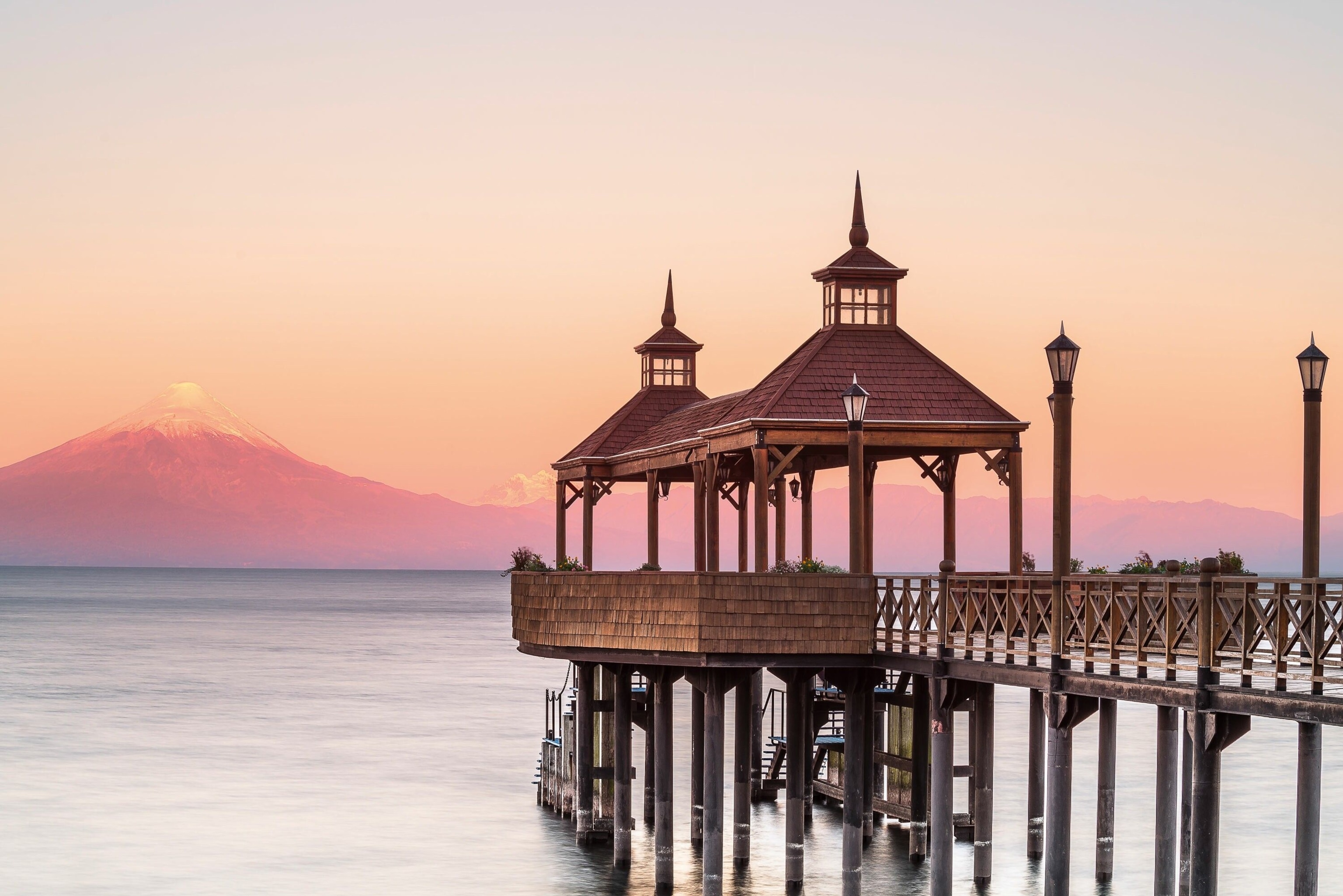 A pier on a lake at sunrise