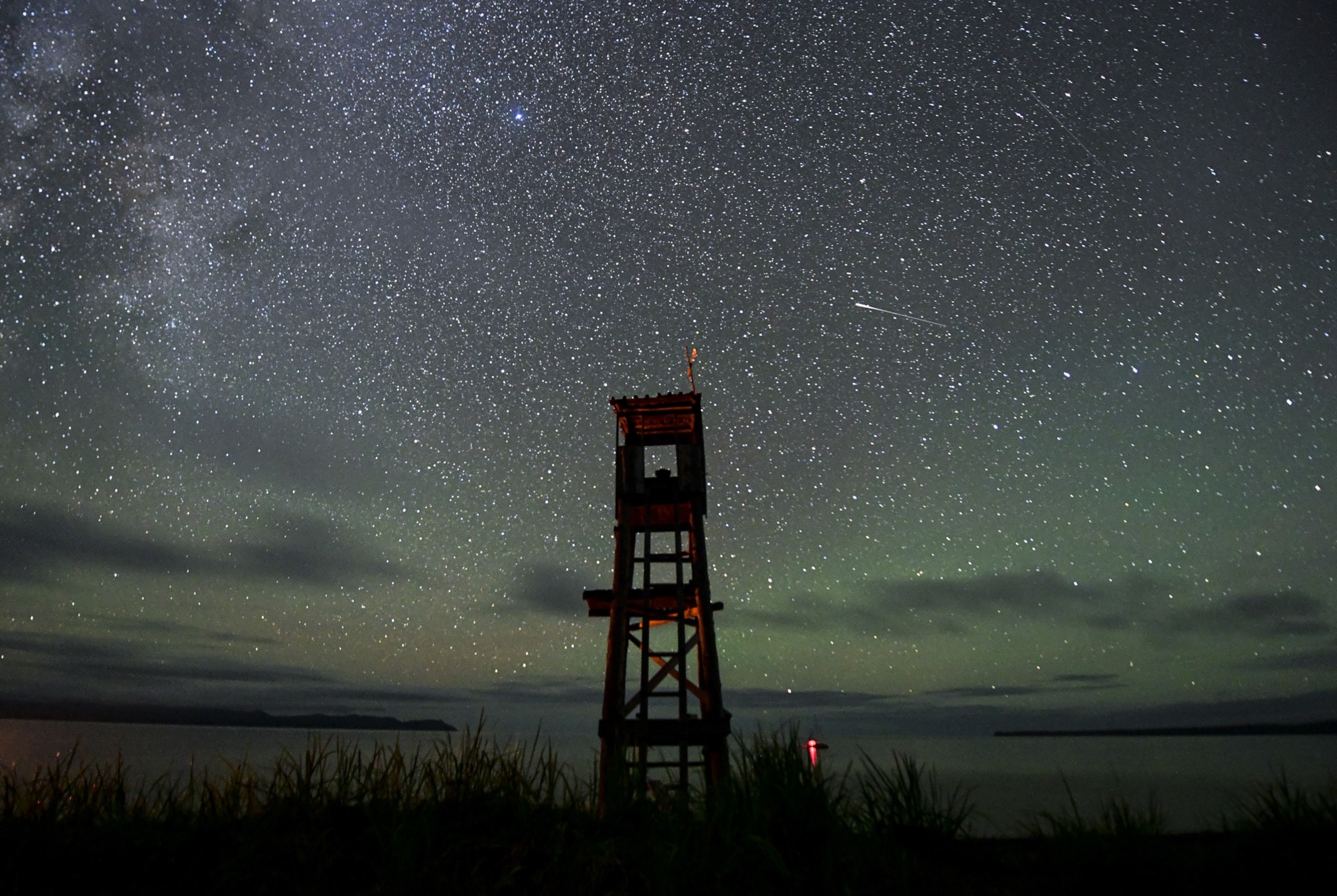 the Perseids meteor shower over an orca watch tower