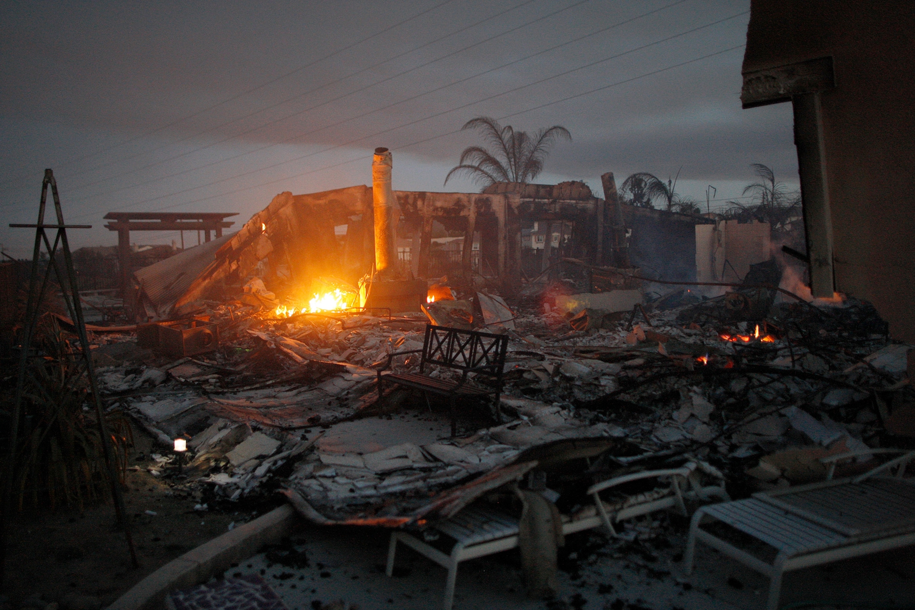 Wildfire climbs a canyon toward homes Wednesday, May 14, 2014, in Carlsbad, Calif.
