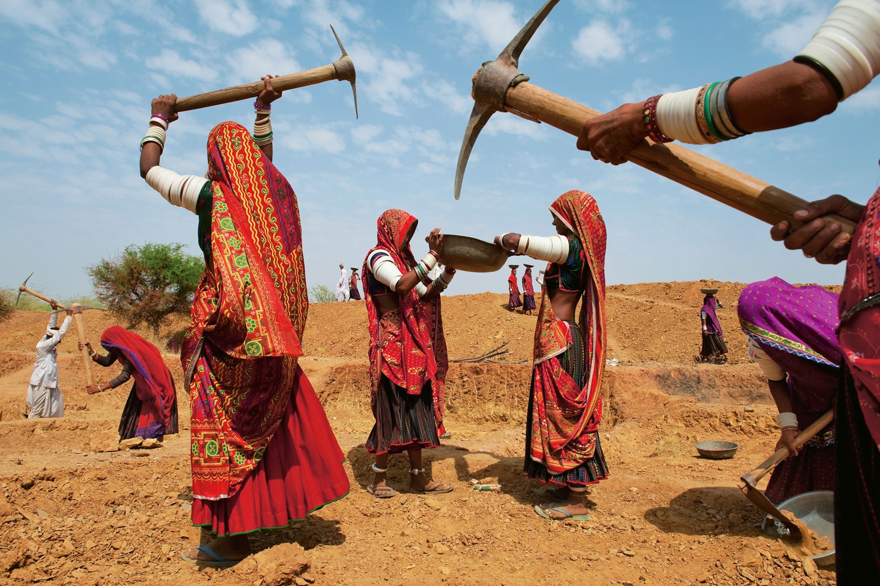 Rabari women earning two dollars a day for digging a reservoir.