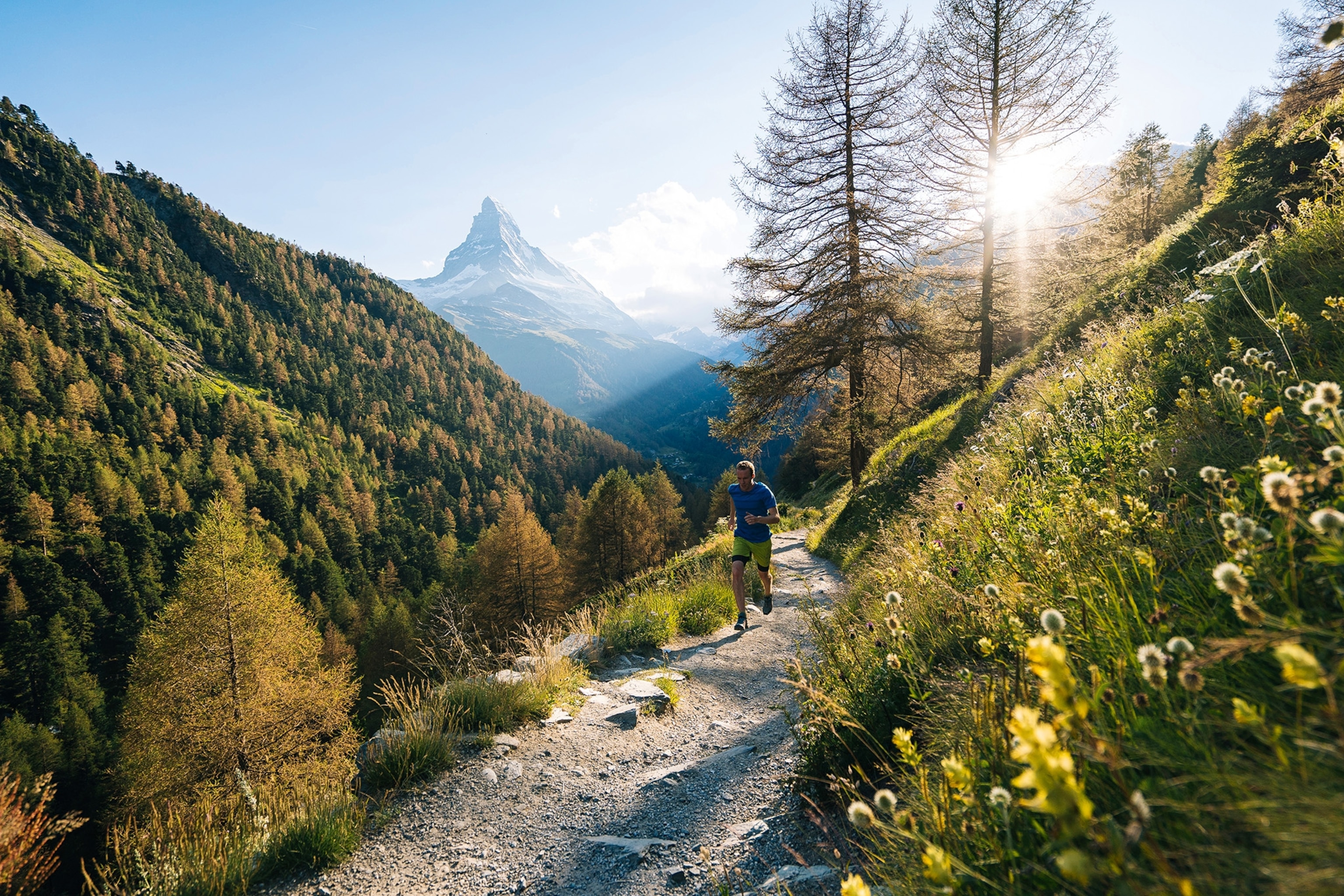 Man running on mountain pass