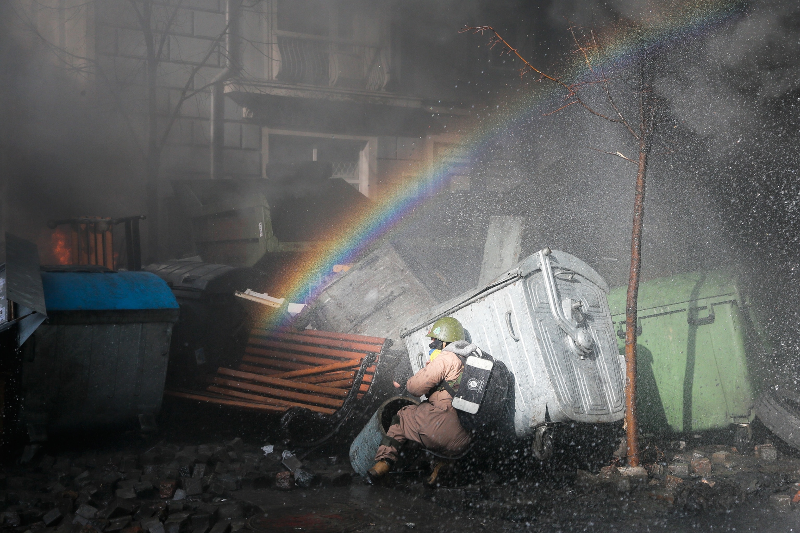Anti-government protesters clash with riot police.