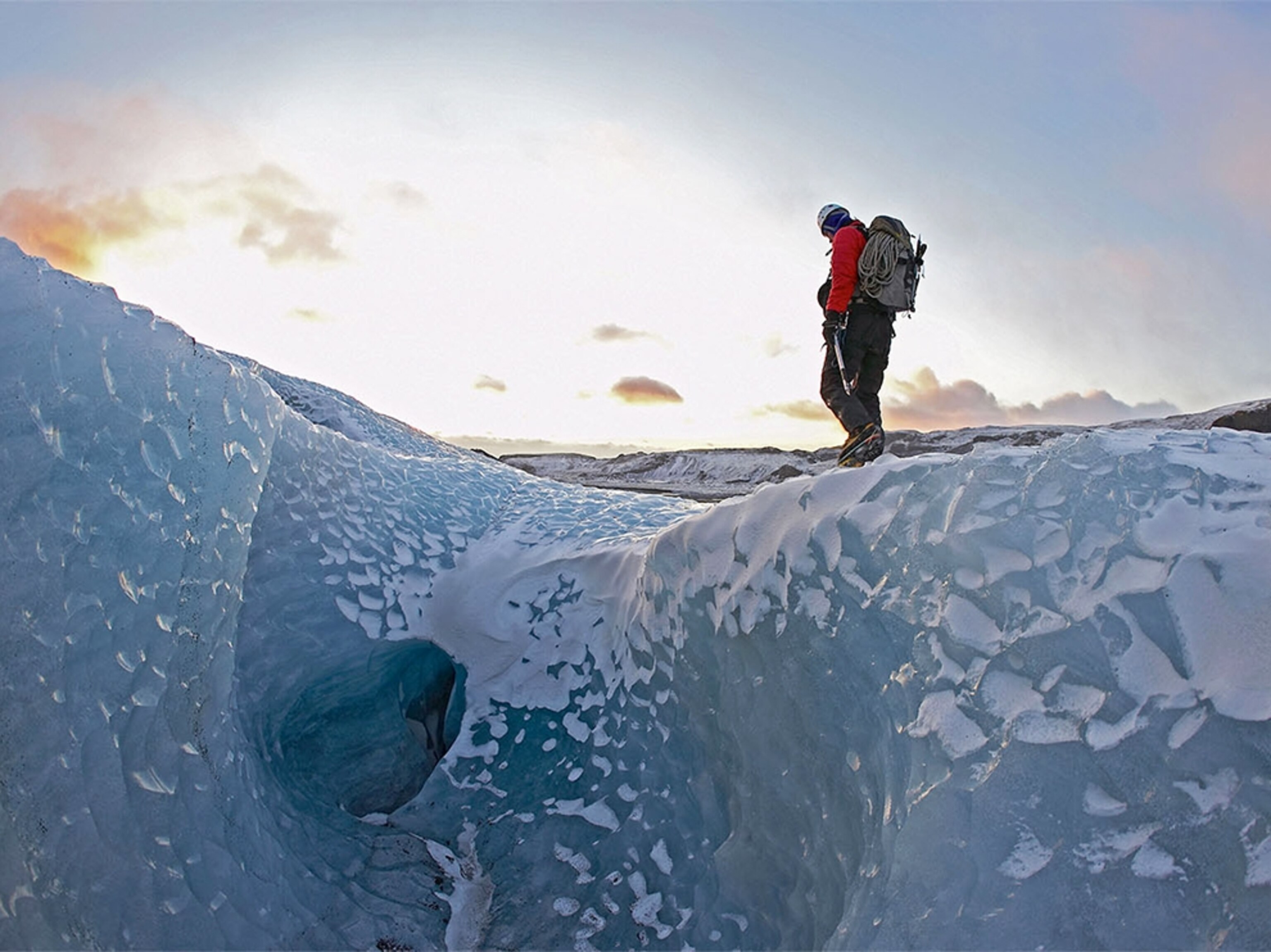 a hiker walking on the Solheimajokull glacier in Iceland
