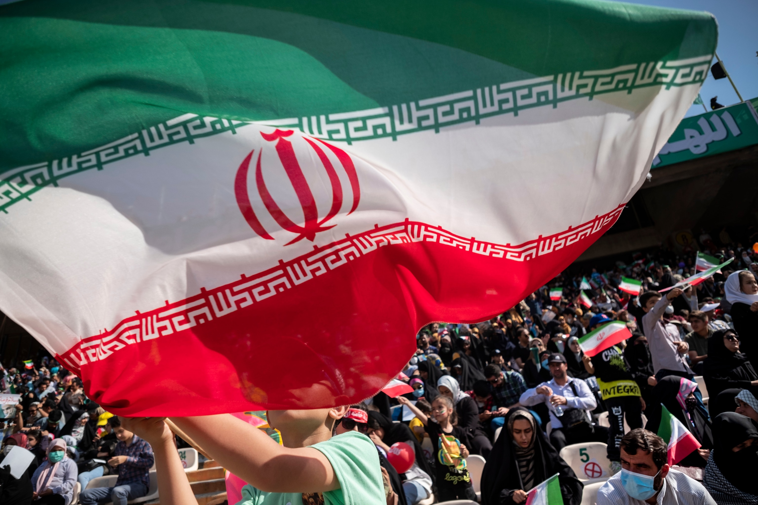 Iranian flag blows in wind.