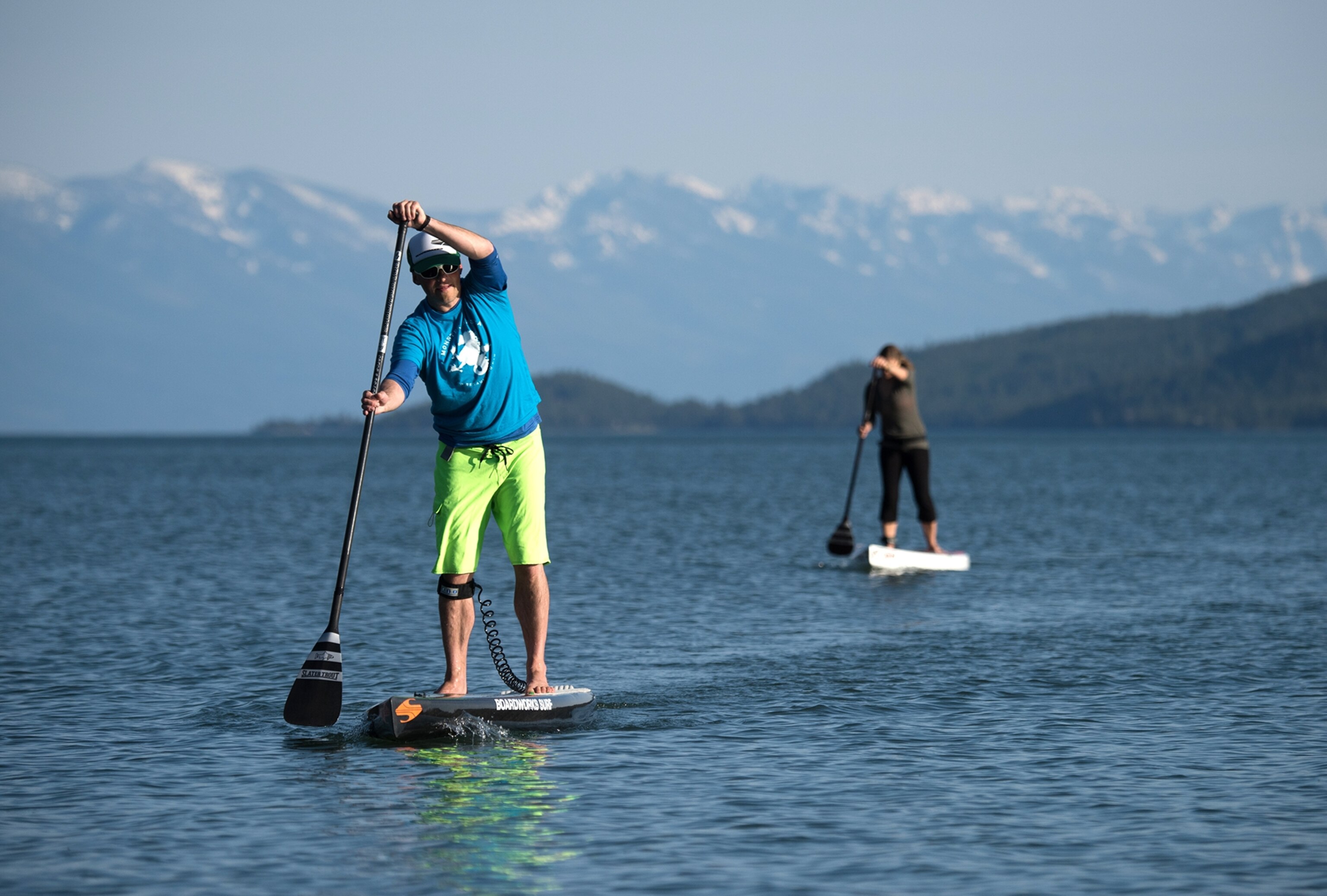 stand-up paddleboarders making their way across Flathead Lake in Montana
