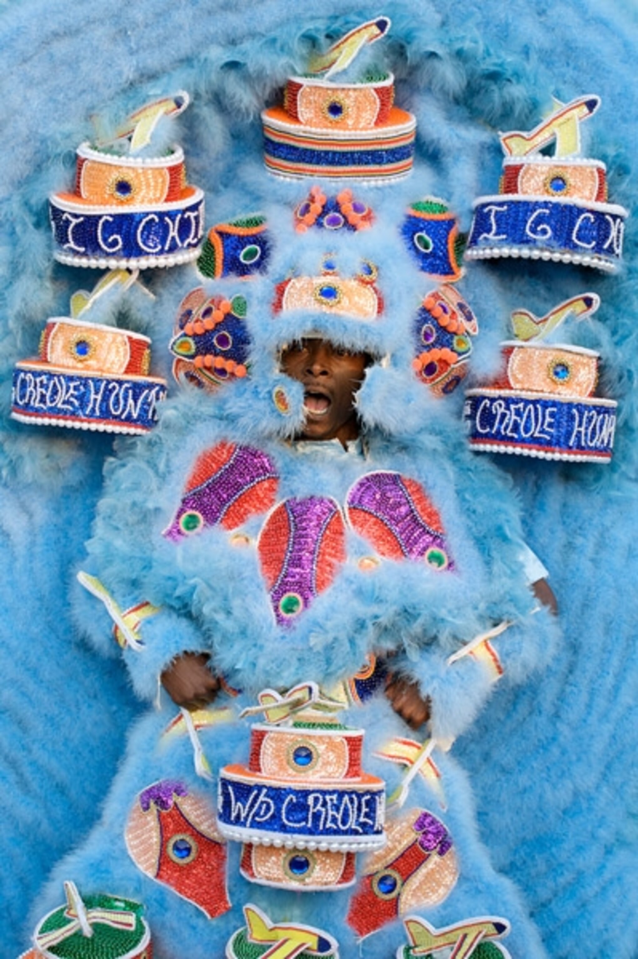 Man in full body costume and headdress
