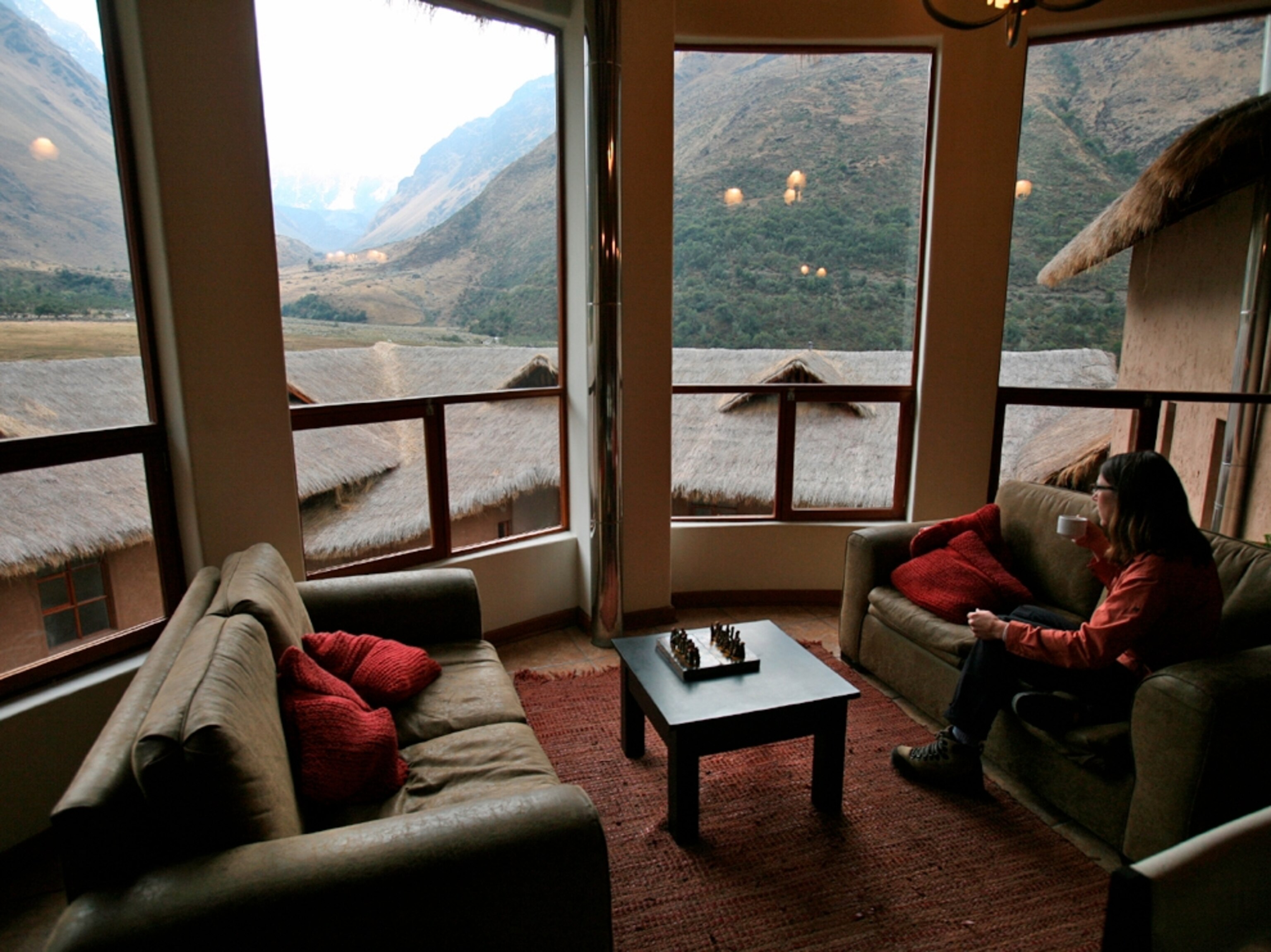 Woman with coffee at Soraypampa Lodge, Peru