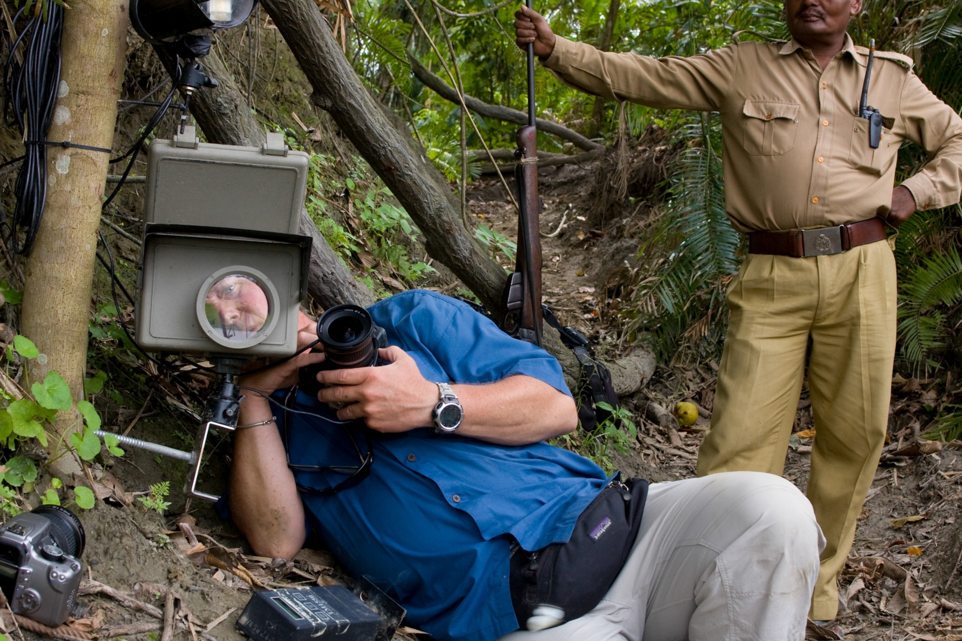 Under the watchful eye of a guard in India’s Kaziranga National Park, I set up camera traps to capture images of Bengal tigers, Asian elephants, Indian one-horned rhinos, and other animals.