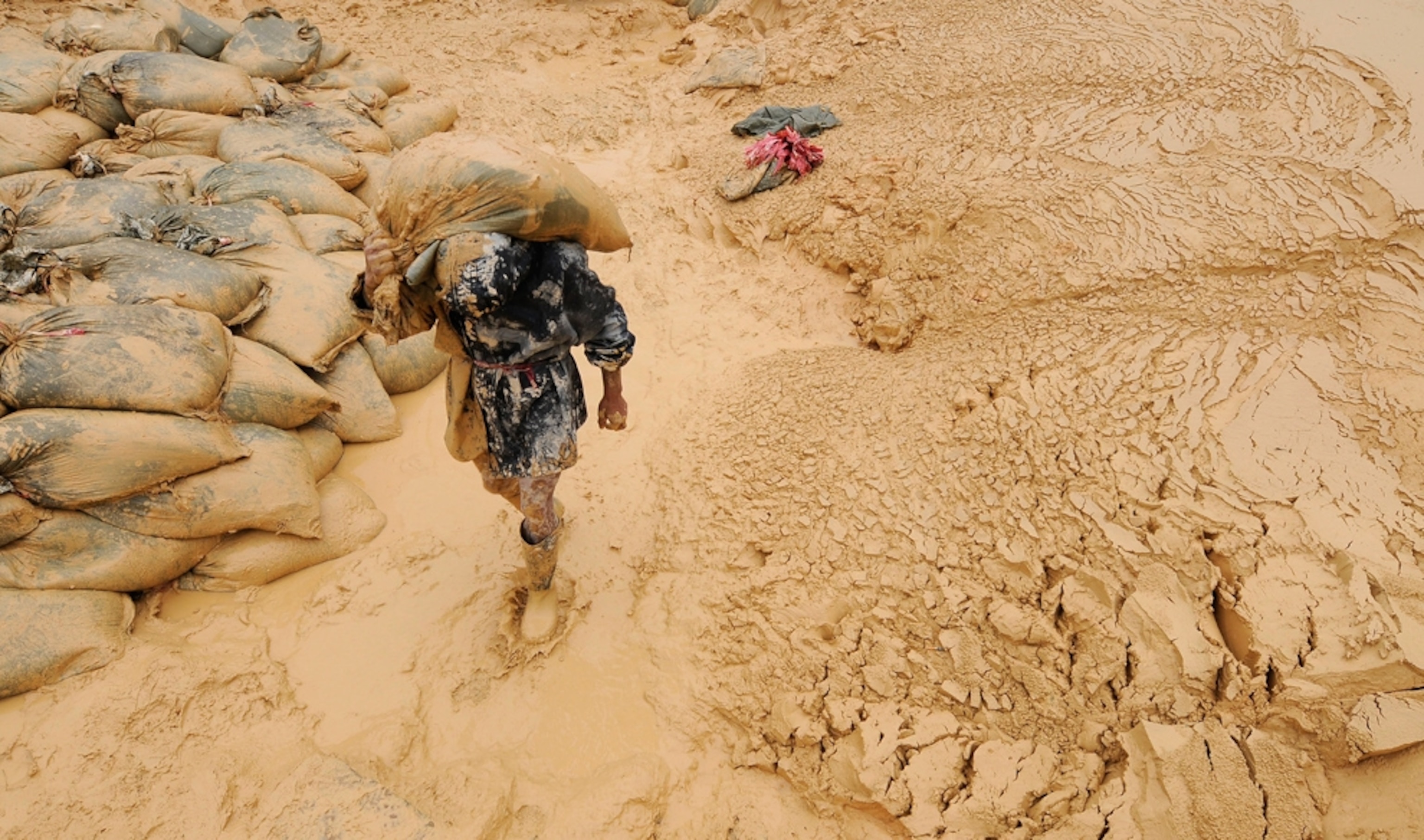 A worker mines rare-earth minerals, Jiangxi Province