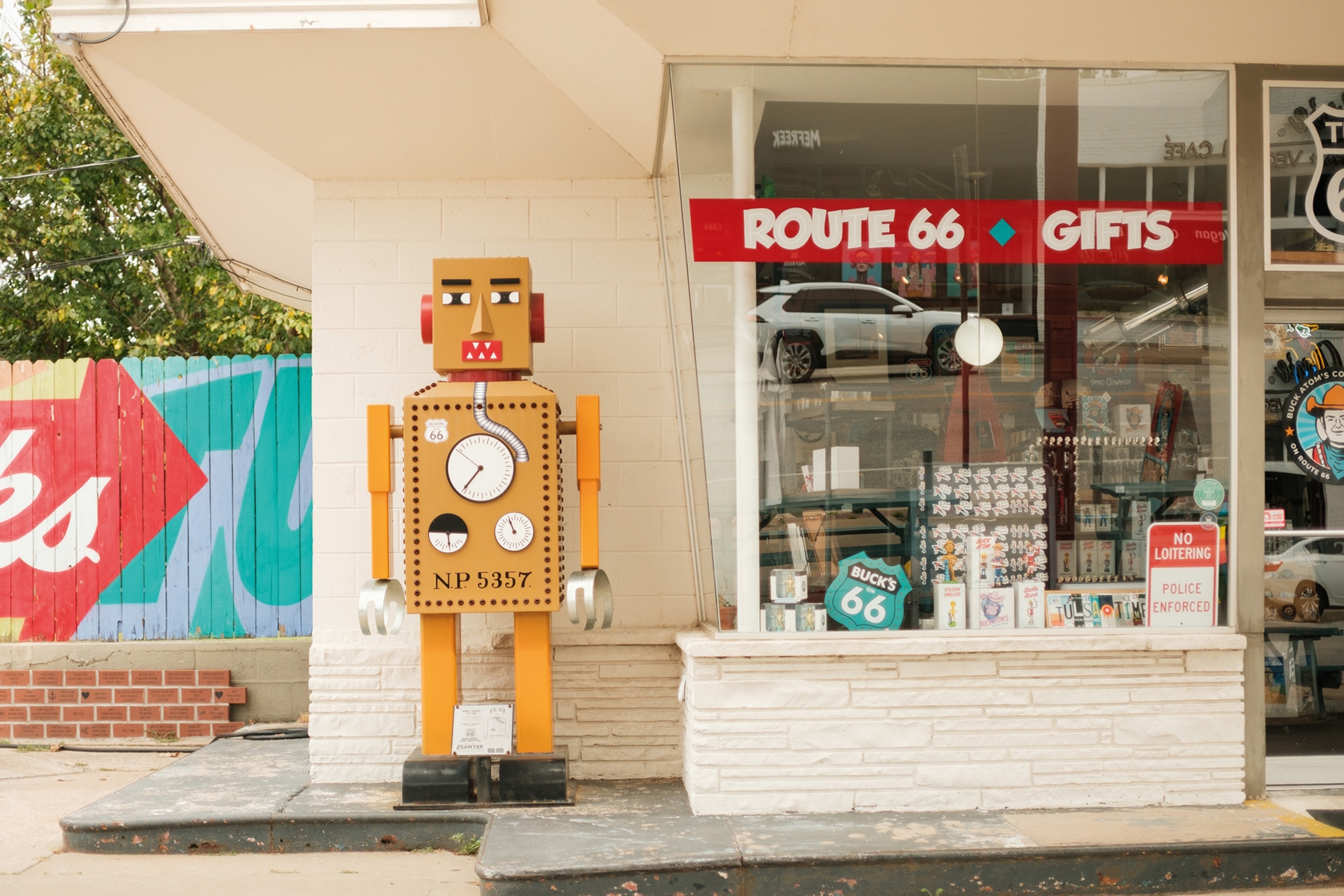 A robot figurine outside a souvenir shop.