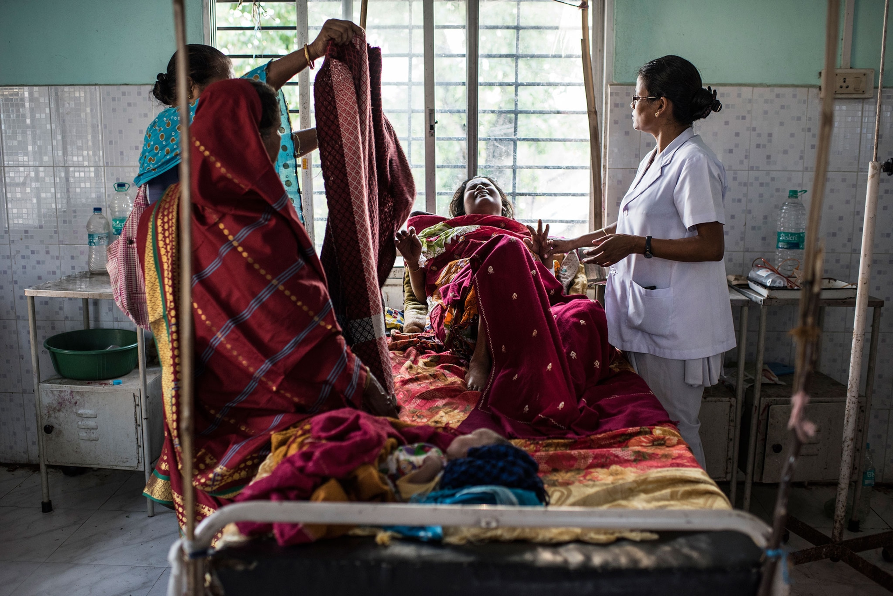 nurse tending to sick mother