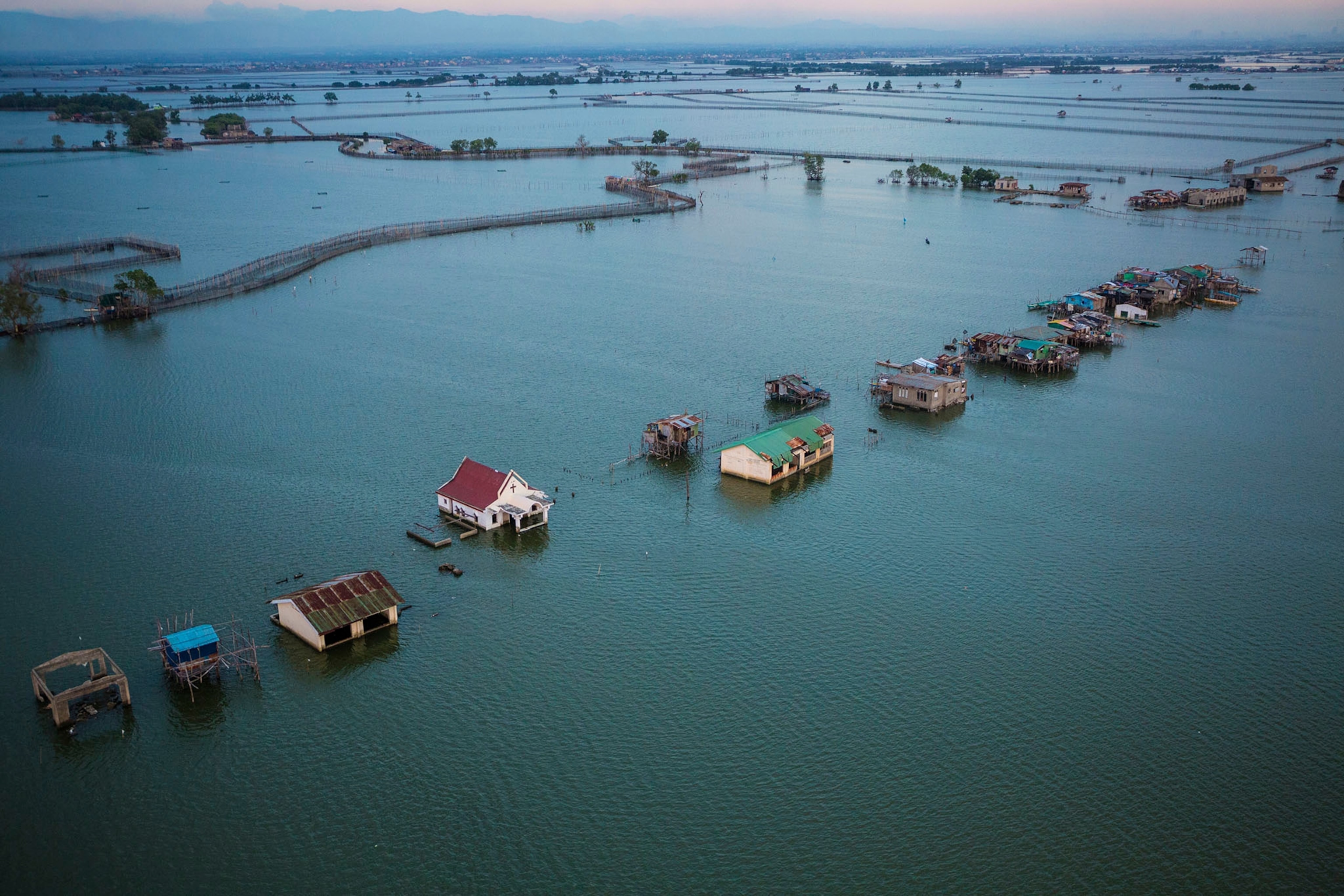 Fishing and fish-farming communities are scattered across the low lying Obando area in the muflats just north of Manila.