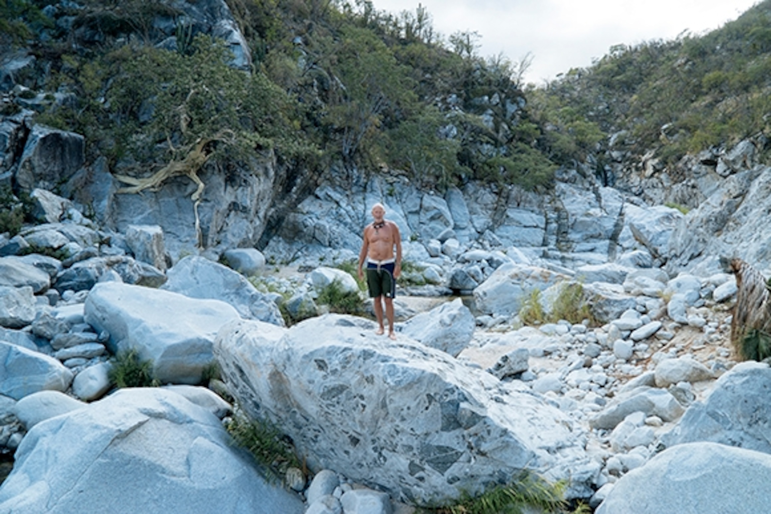 Chris Mathias leads the group up the canyon at Aguas Calientes, Baja, Mexico; Photograph by Max Lowe